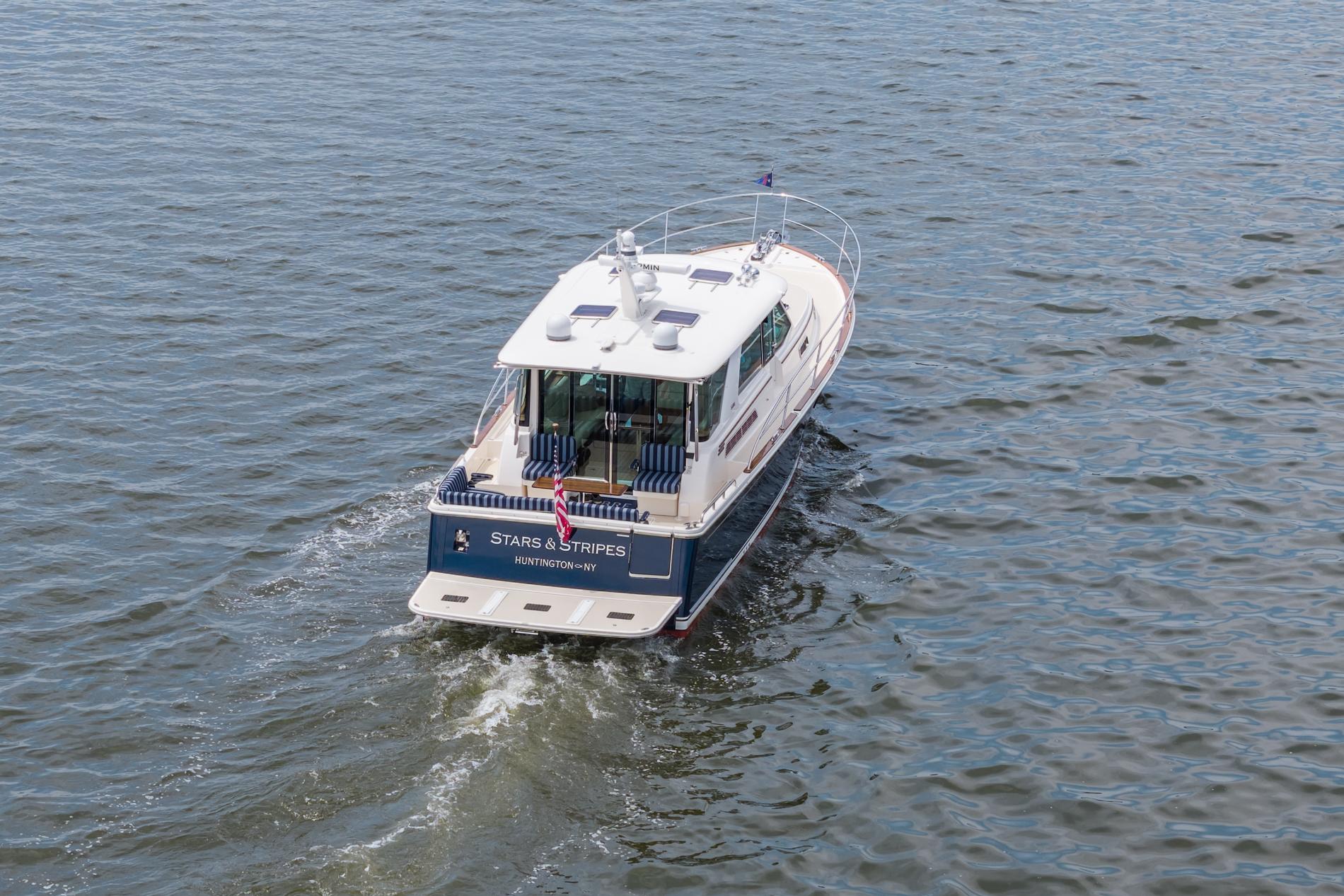 2024 Sabre 43 Salon Express yacht cruising on open water.