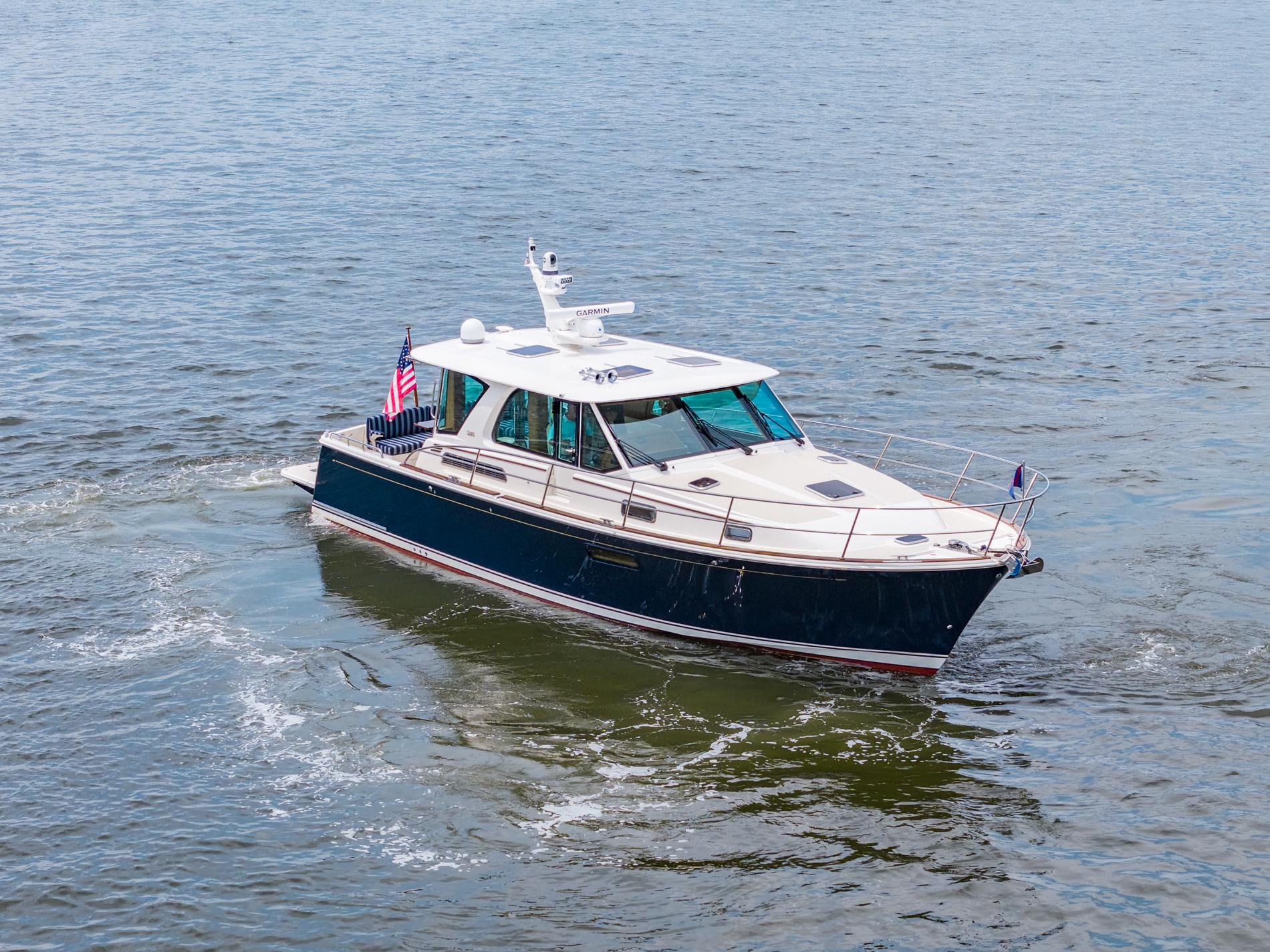 2024 Sabre 43 Salon Express yacht cruising on open water.