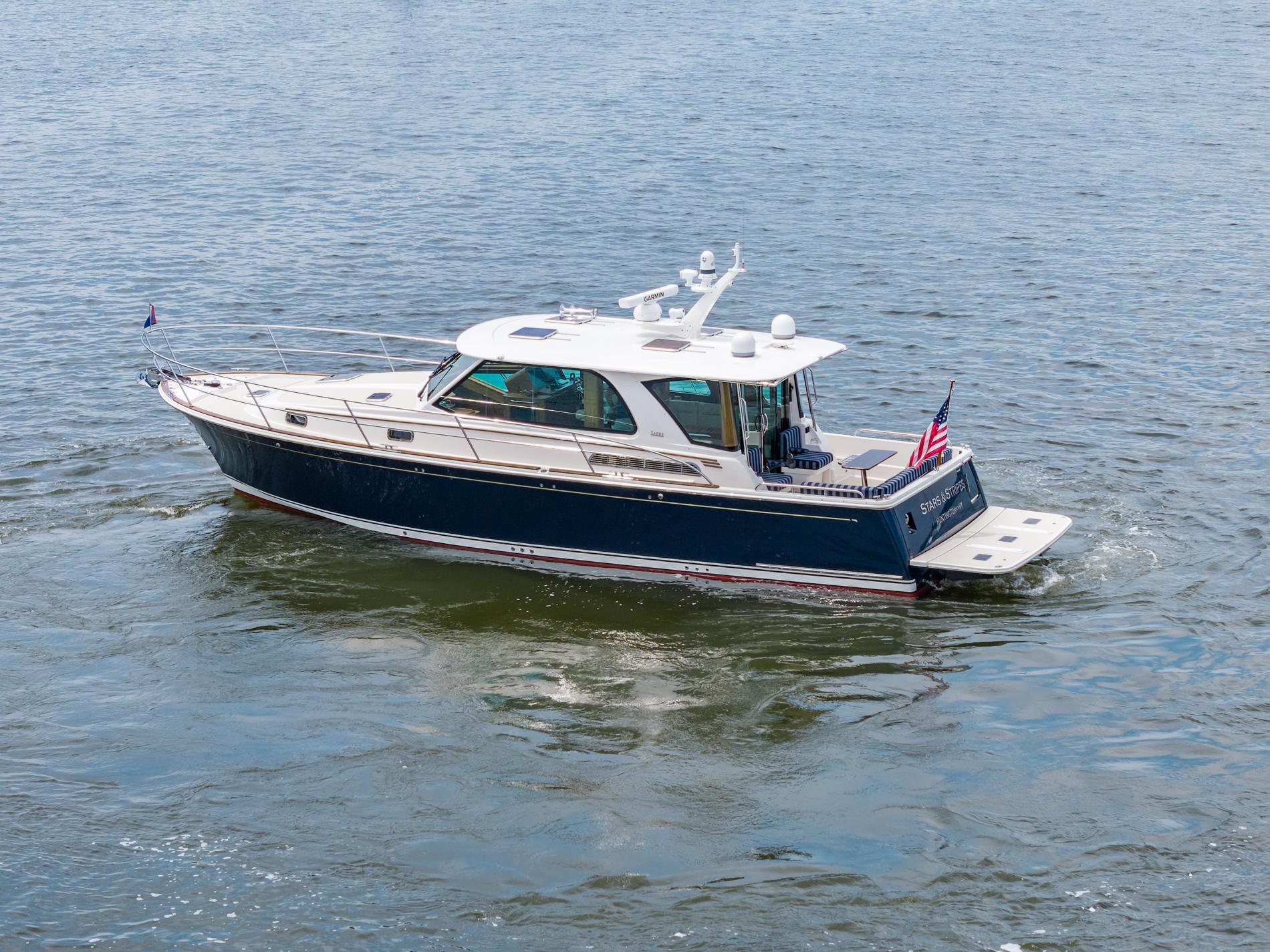 2024 Sabre 43 Salon Express yacht cruising on open water.