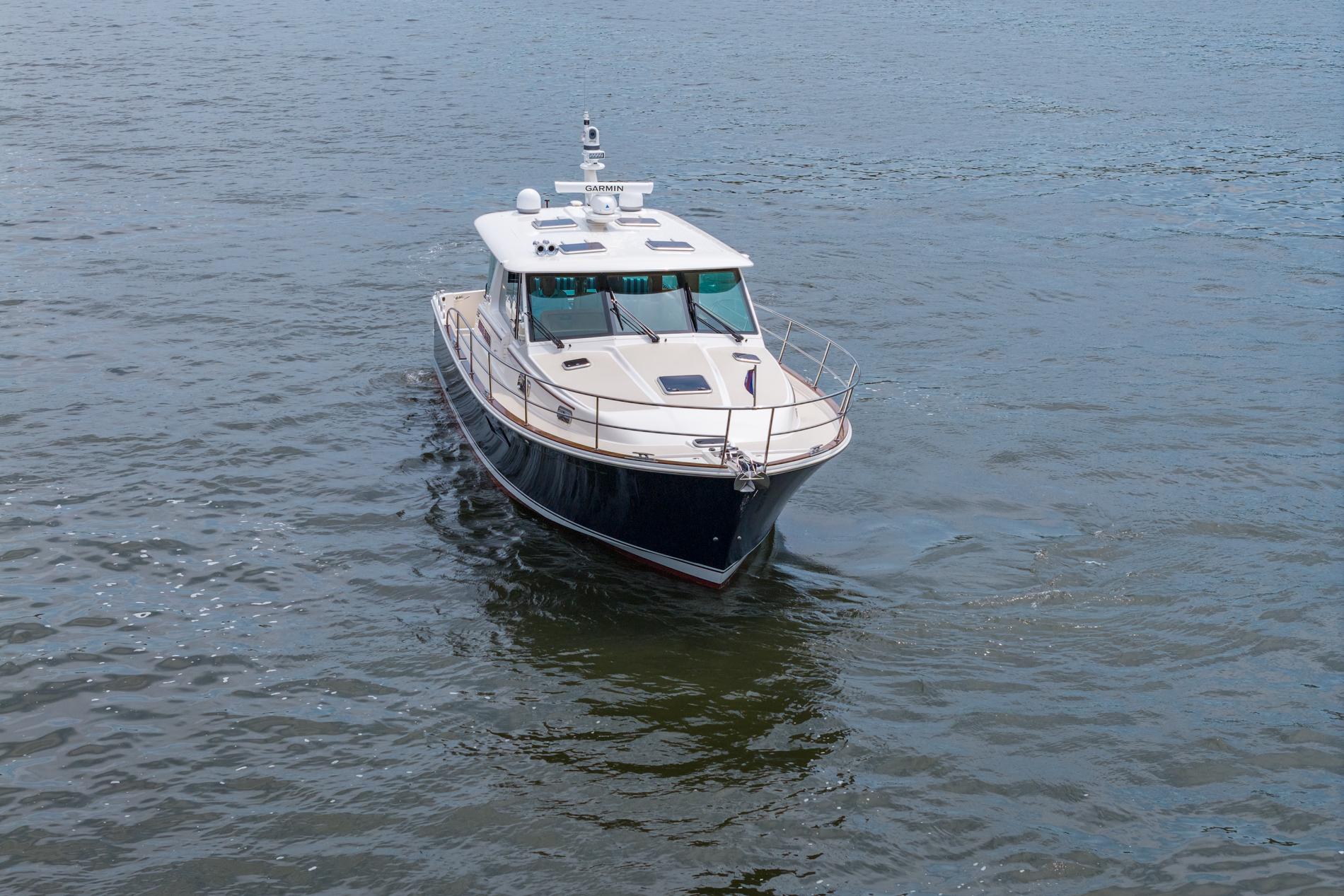 2024 Sabre 43 Salon Express yacht cruising on open water.
