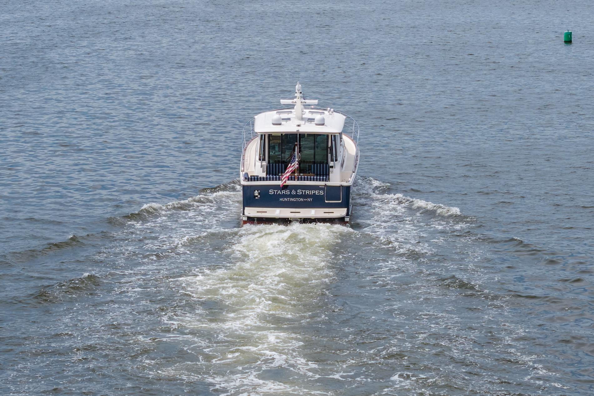 2024 Sabre 43 Salon Express yacht cruising on open water.