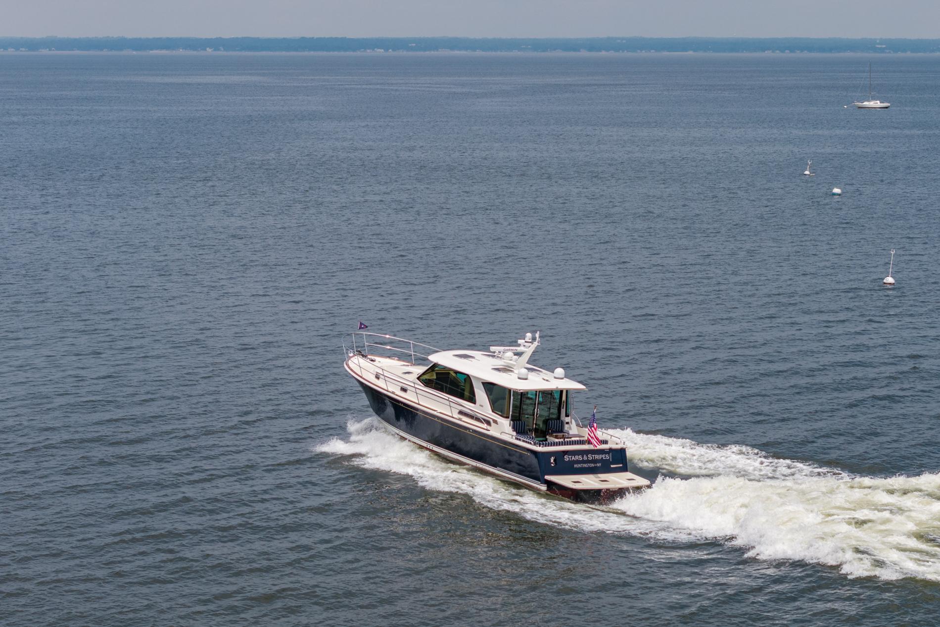 2024 Sabre 43 Salon Express yacht cruising on open water.
