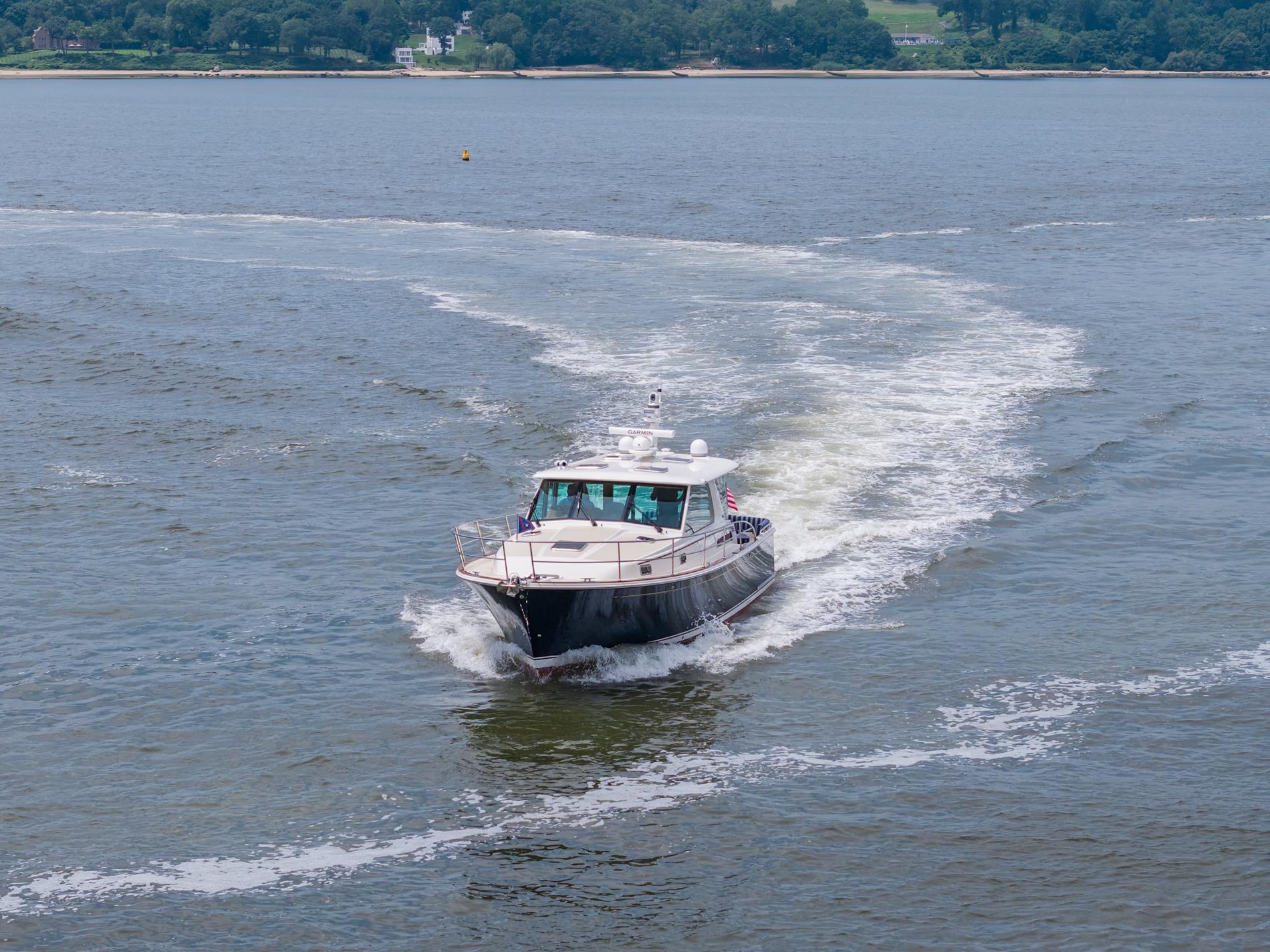 2024 Sabre 43 Salon Express cruising on open water.