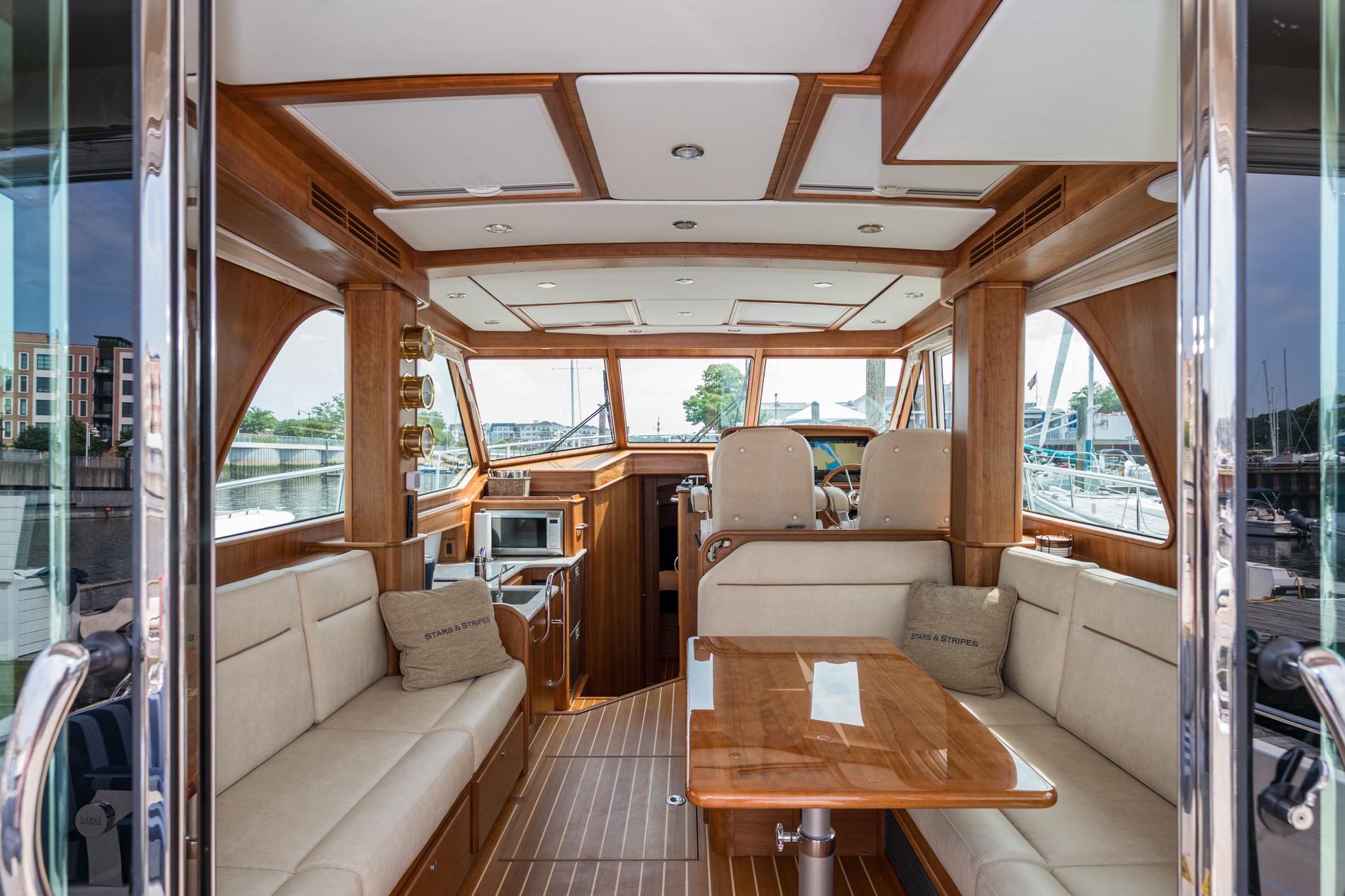 2024 Sabre 43 Salon Express interior with luxurious seating and wooden finishes.