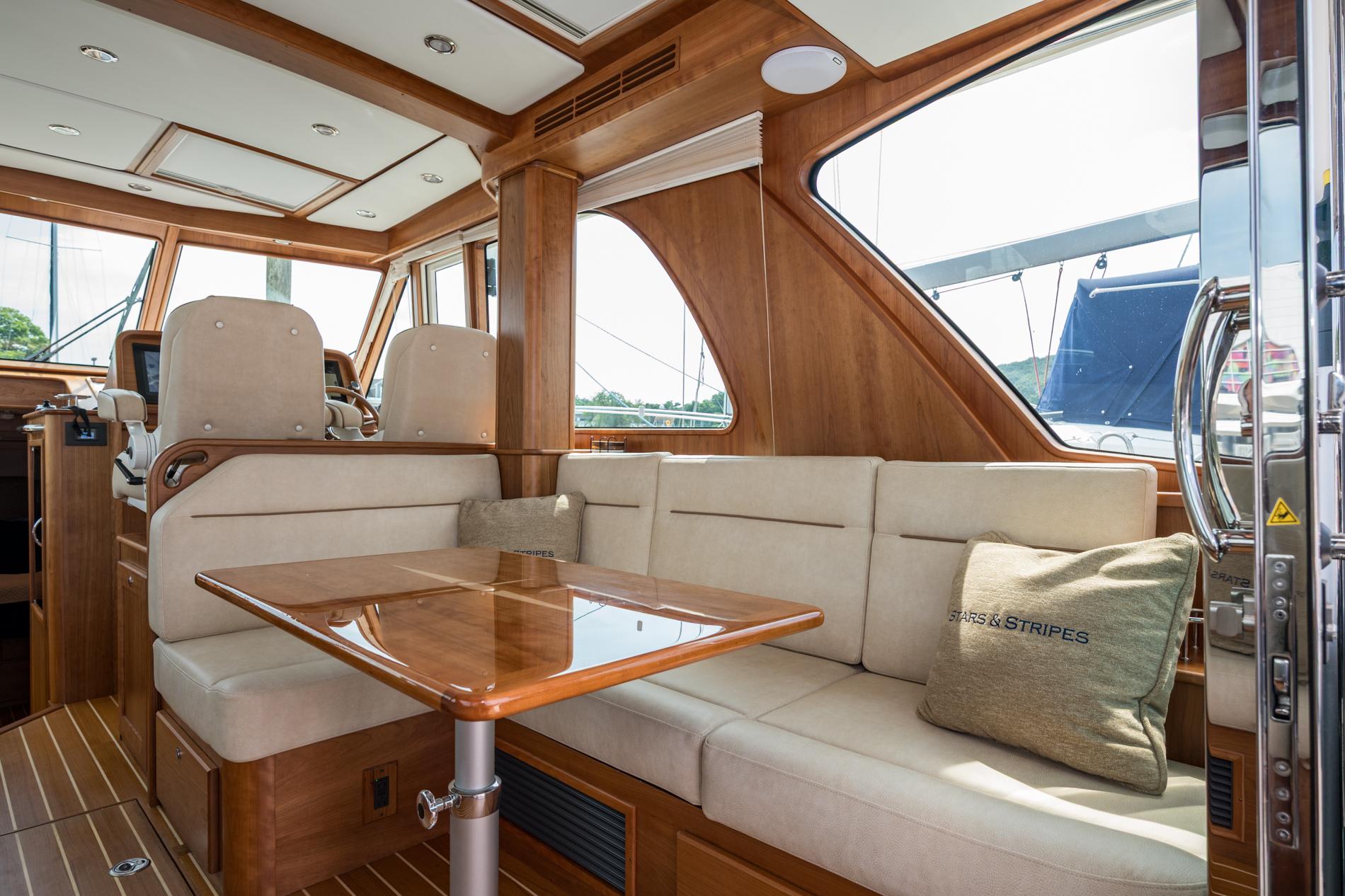2024 Sabre 43 Salon Express interior with elegant seating and wooden accents.