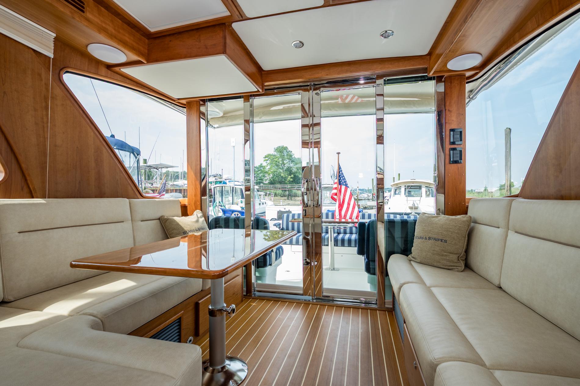 2024 Sabre 43 Salon Express interior with elegant seating and wooden finishes.