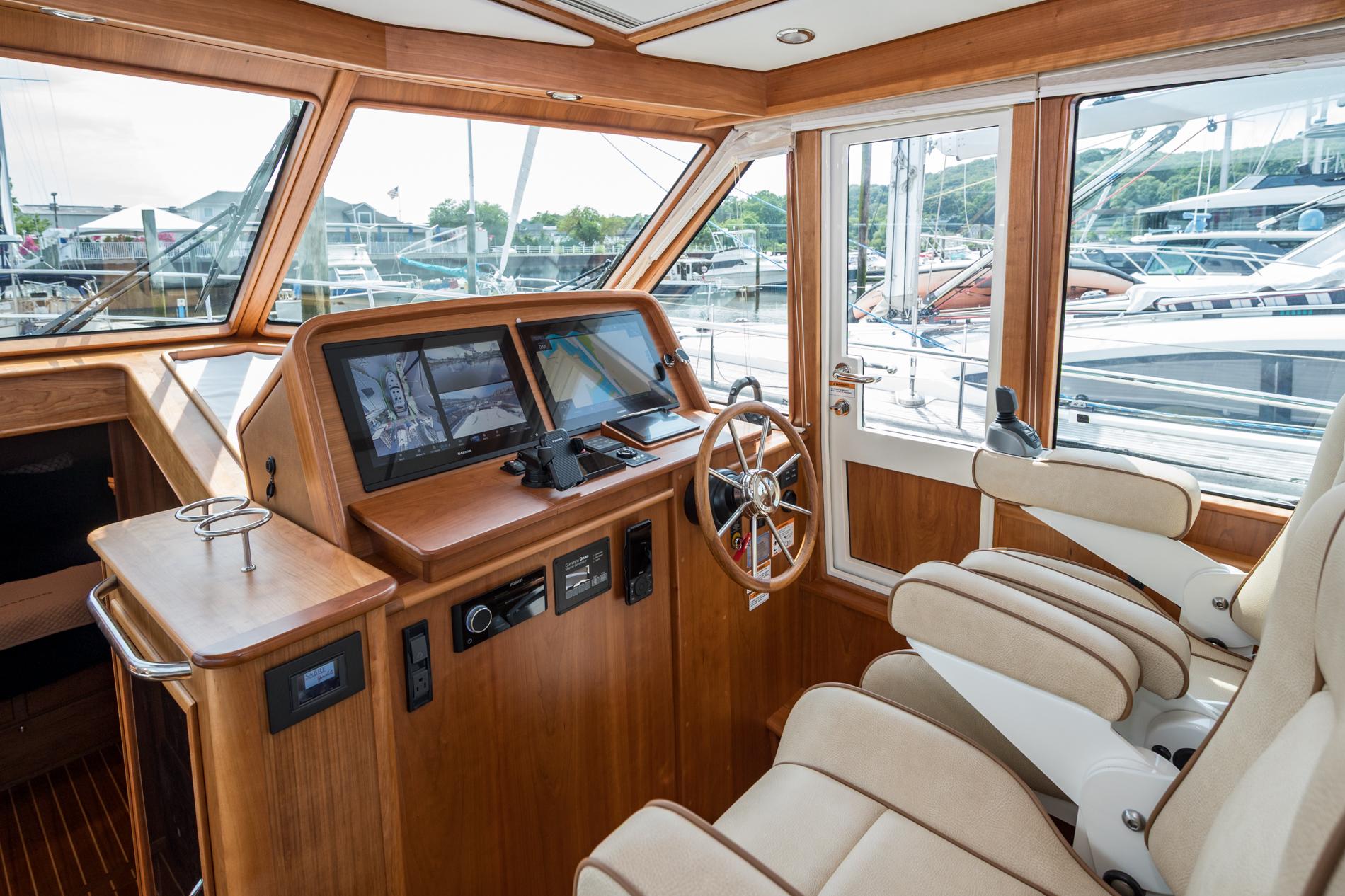 2024 Sabre 43 Salon Express helm with modern controls and luxurious seating.