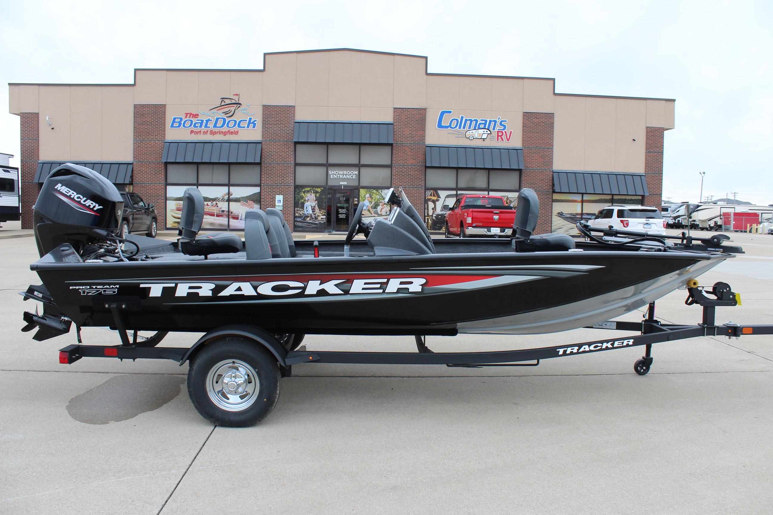 2025 Tracker Pro Team 175 Crappie Edition boat on trailer outside dealership.