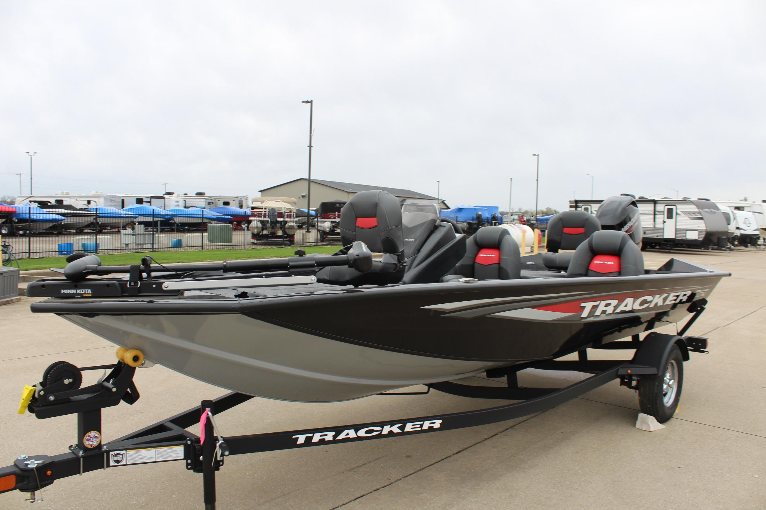 2025 Tracker Pro Team 175 Crappie Edition boat on trailer, parked outdoors.