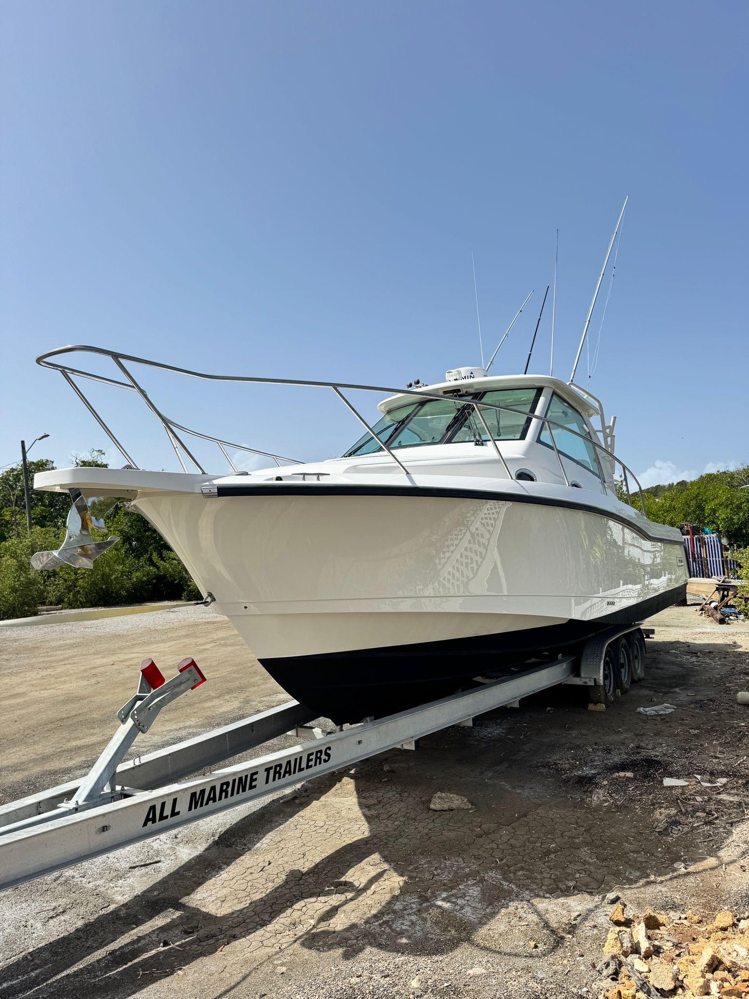 Boston Whaler-345 Conquest 2012 -PR-2012 Boston Whaler 345 Conquest on a trailer in a sunny outdoor setting.-9446483 | Thumbnail