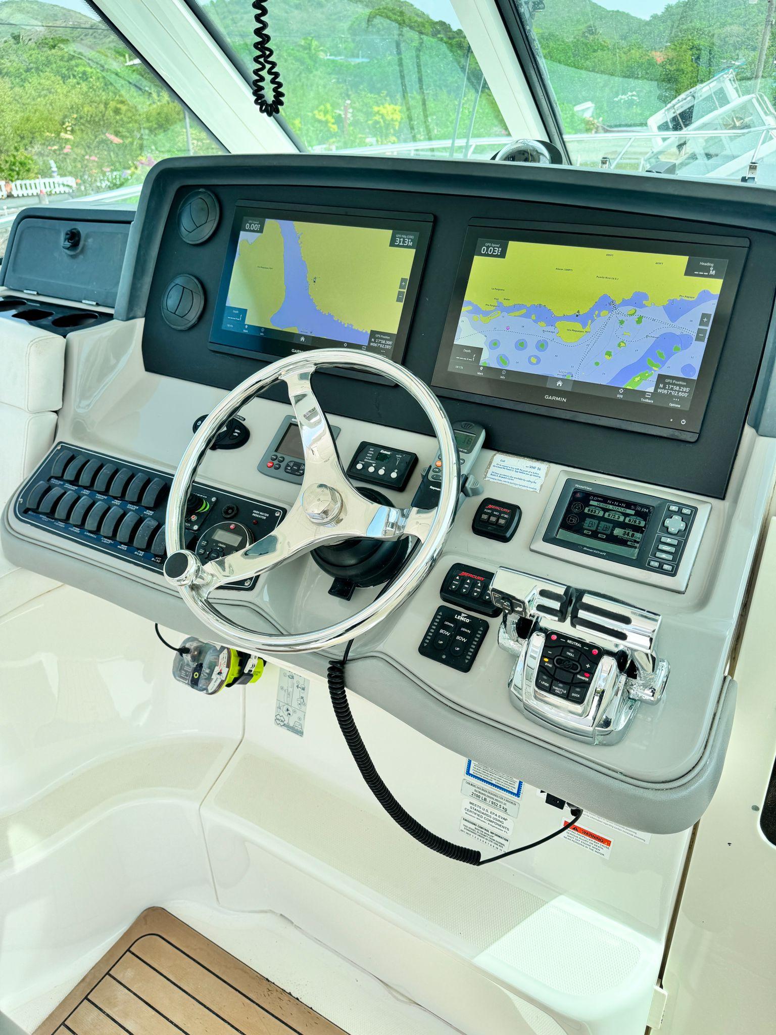 Boston Whaler-345 Conquest 2012 -PR-Control panel of a 2012 Boston Whaler 345 Conquest boat with navigation screens.-9446483 | Thumbnail
