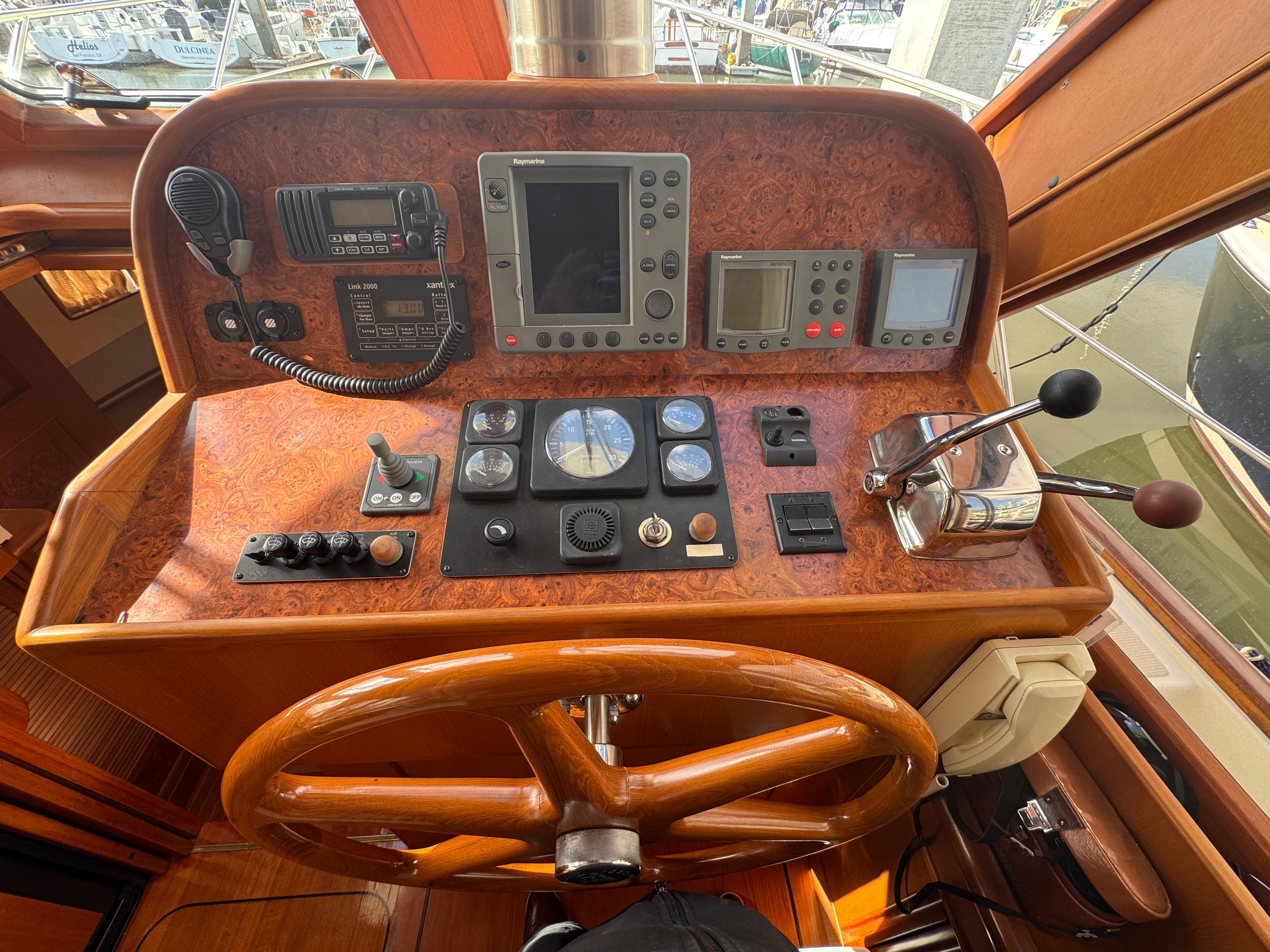Helm of 2003 President Performance Trawler with navigation and control instruments.