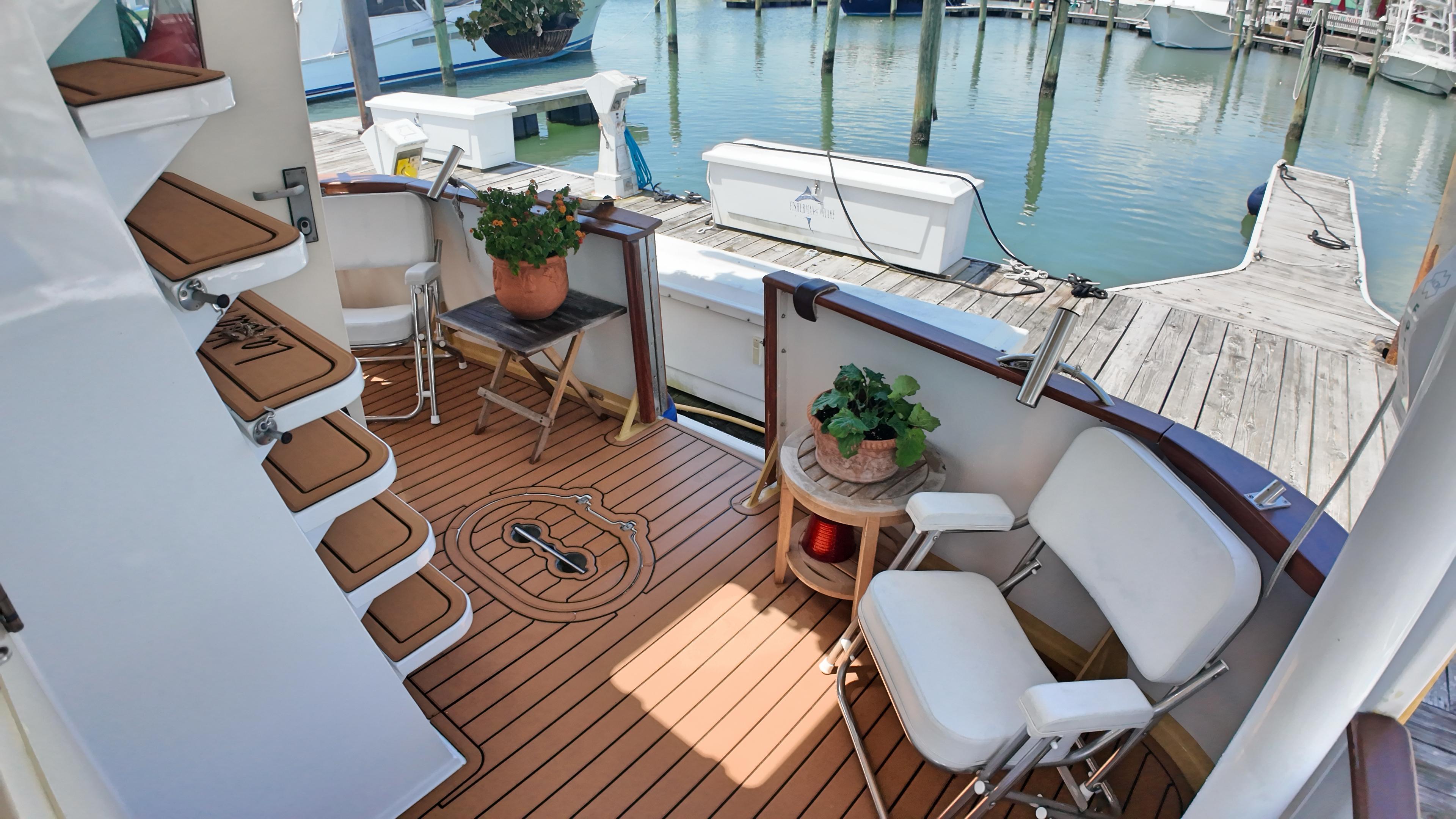 Custom-Holland Marine 50 Custom Trawler 1993-La Vita Marina SC-US-Custom Holland Marine 50 Trawler deck with seating, plants, and dock view, 1993 model.-9816492 | Thumbnail