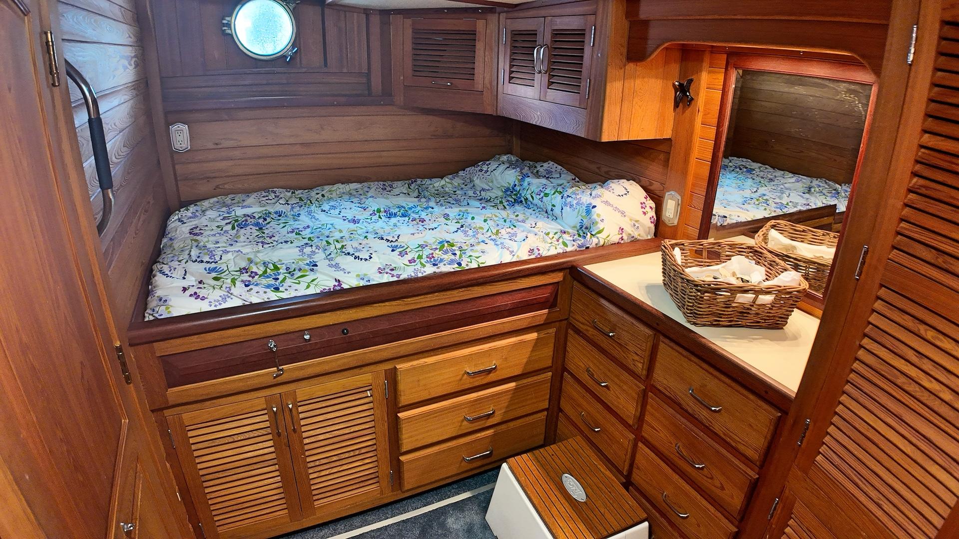 Custom-Holland Marine 50 Custom Trawler 1993-La Vita Marina SC-US-Cozy wooden cabin interior of 1993 Holland Marine 50 Custom Trawler with bed and storage.-9816492 | Thumbnail