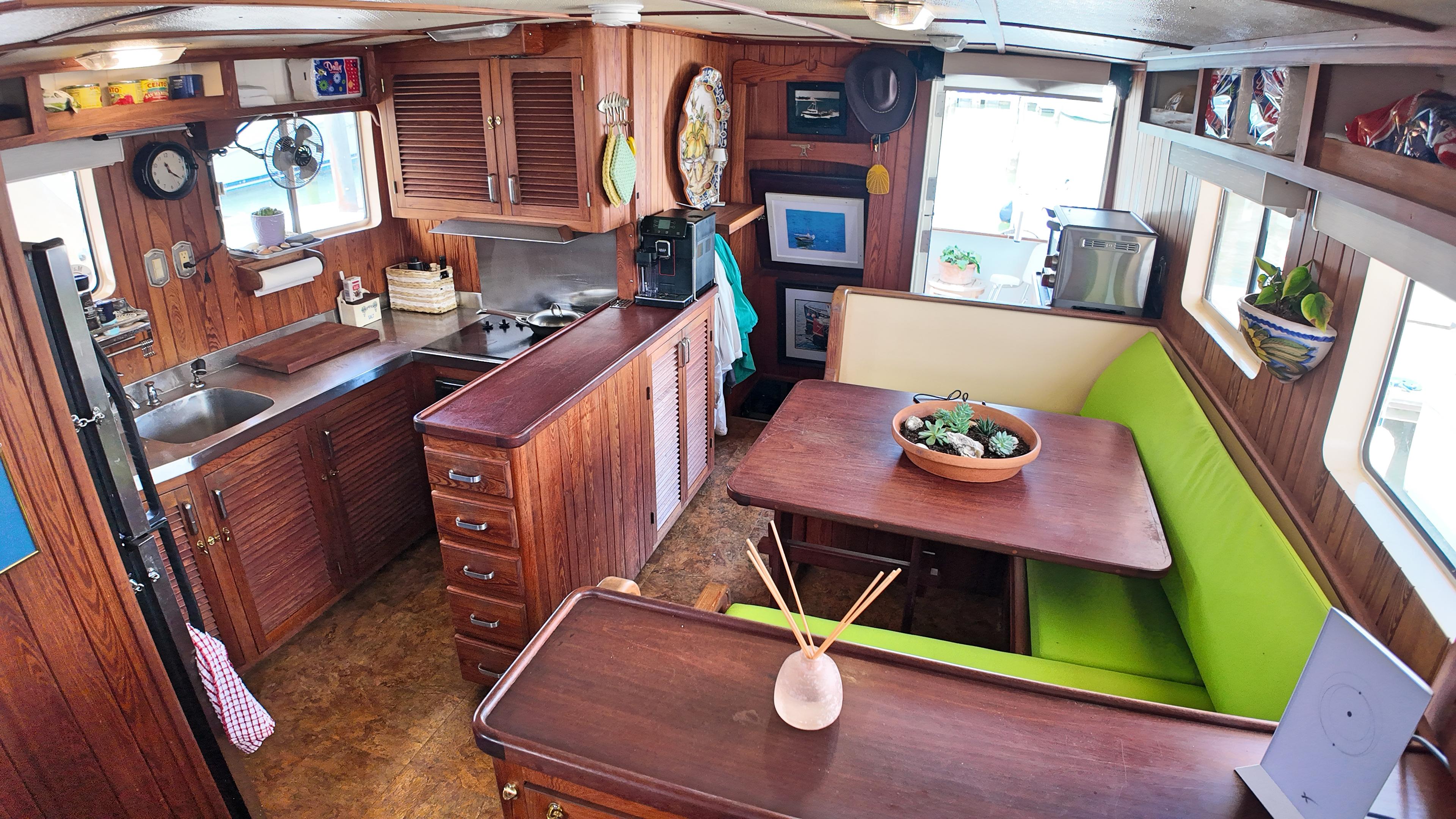 Custom-Holland Marine 50 Custom Trawler 1993-La Vita Marina SC-US-Interior of 1993 Holland Marine 50 Custom Trawler with wooden cabinetry and green seating.-9816492 | Thumbnail
