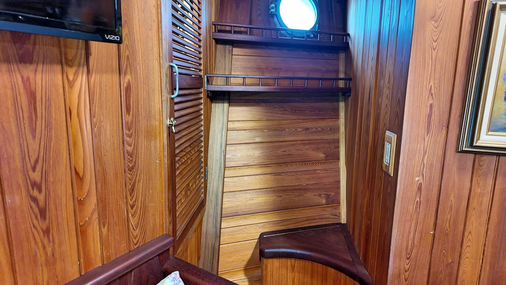 Custom-Holland Marine 50 Custom Trawler 1993-La Vita Marina SC-US-Interior of 1993 Holland Marine 50 Custom Trawler with wooden paneling and porthole.-9816492 | Thumbnail