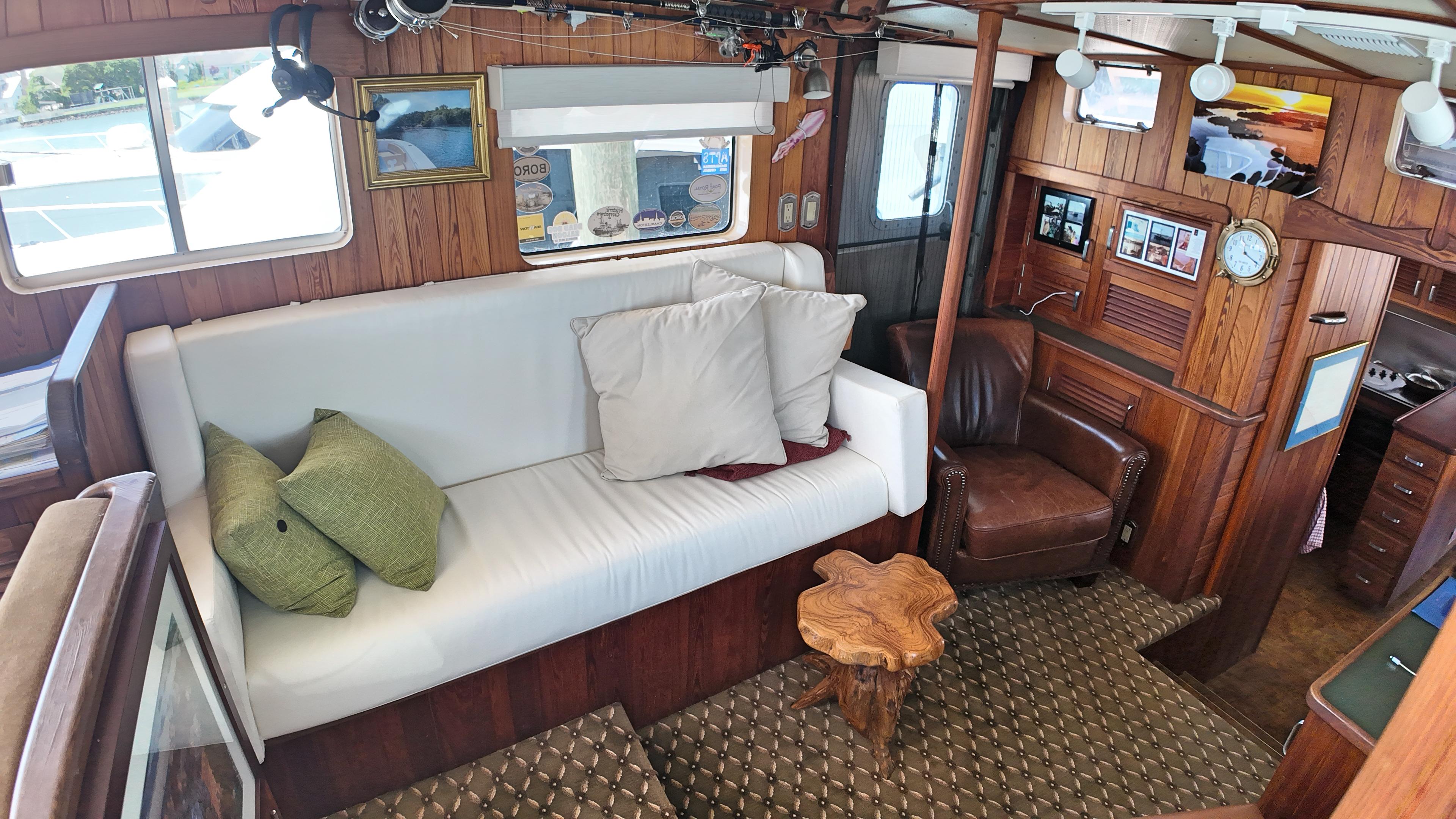 Custom-Holland Marine 50 Custom Trawler 1993-La Vita Marina SC-US-Interior of 1993 Holland Marine 50 Custom Trawler with cozy seating and wooden decor.-9816492 | Thumbnail