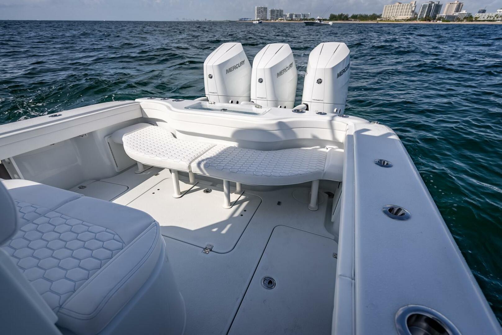 Yellowfin-34 Offshore 2025-34 Offshore FL-US-2025 Yellowfin 34 Offshore boat with triple Mercury engines on open water.-9806499 | Thumbnail