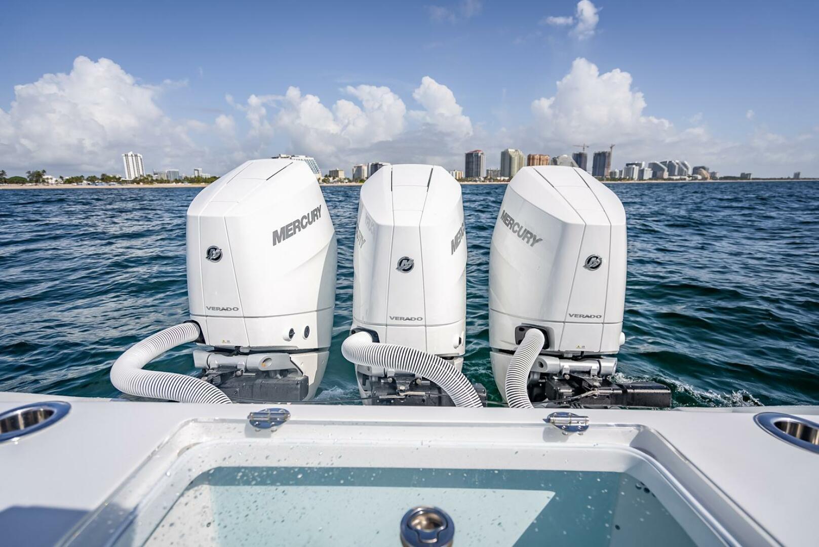 Yellowfin-34 Offshore 2025-34 Offshore FL-US-Triple Mercury outboard engines on a 2025 Yellowfin 34 Offshore boat, city skyline in background.-9806499 | Thumbnail