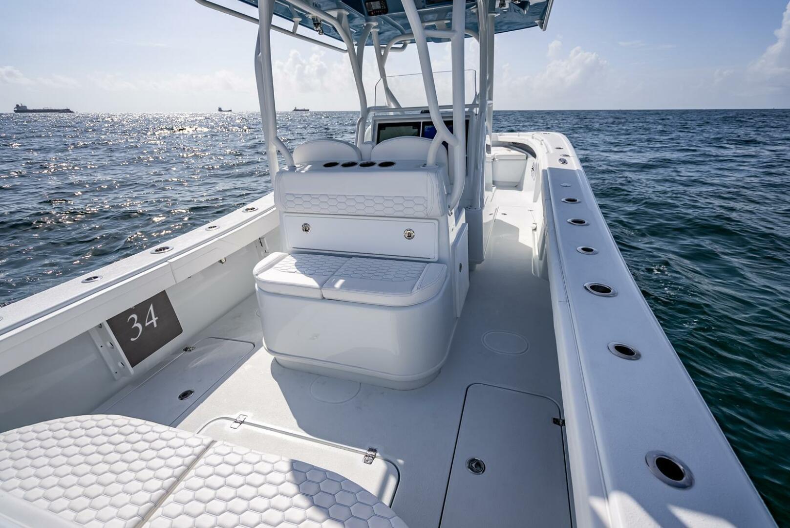 Yellowfin-34 Offshore 2025-34 Offshore FL-US-2025 Yellowfin 34 Offshore boat on open water, showcasing spacious deck and seating.-9806499 | Thumbnail
