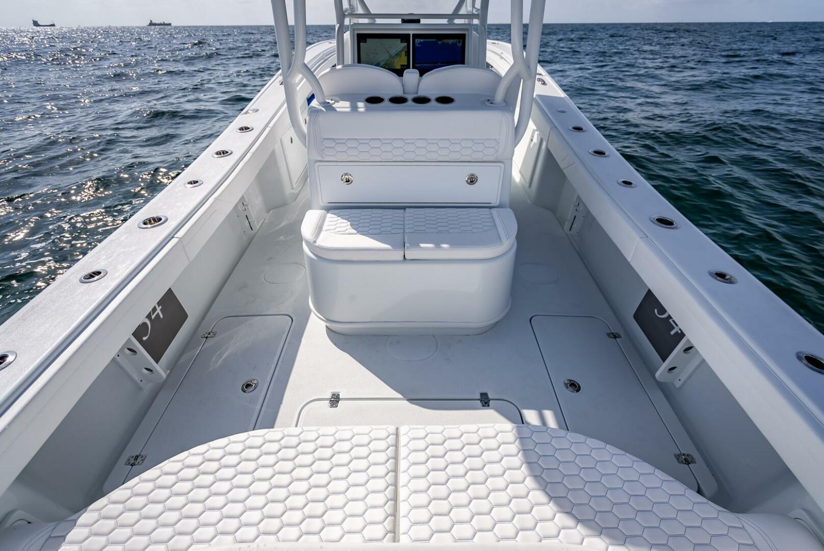 Yellowfin-34 Offshore 2025-34 Offshore FL-US-2025 Yellowfin 34 Offshore boat on open water, showcasing spacious deck and seating.-9806499 | Thumbnail