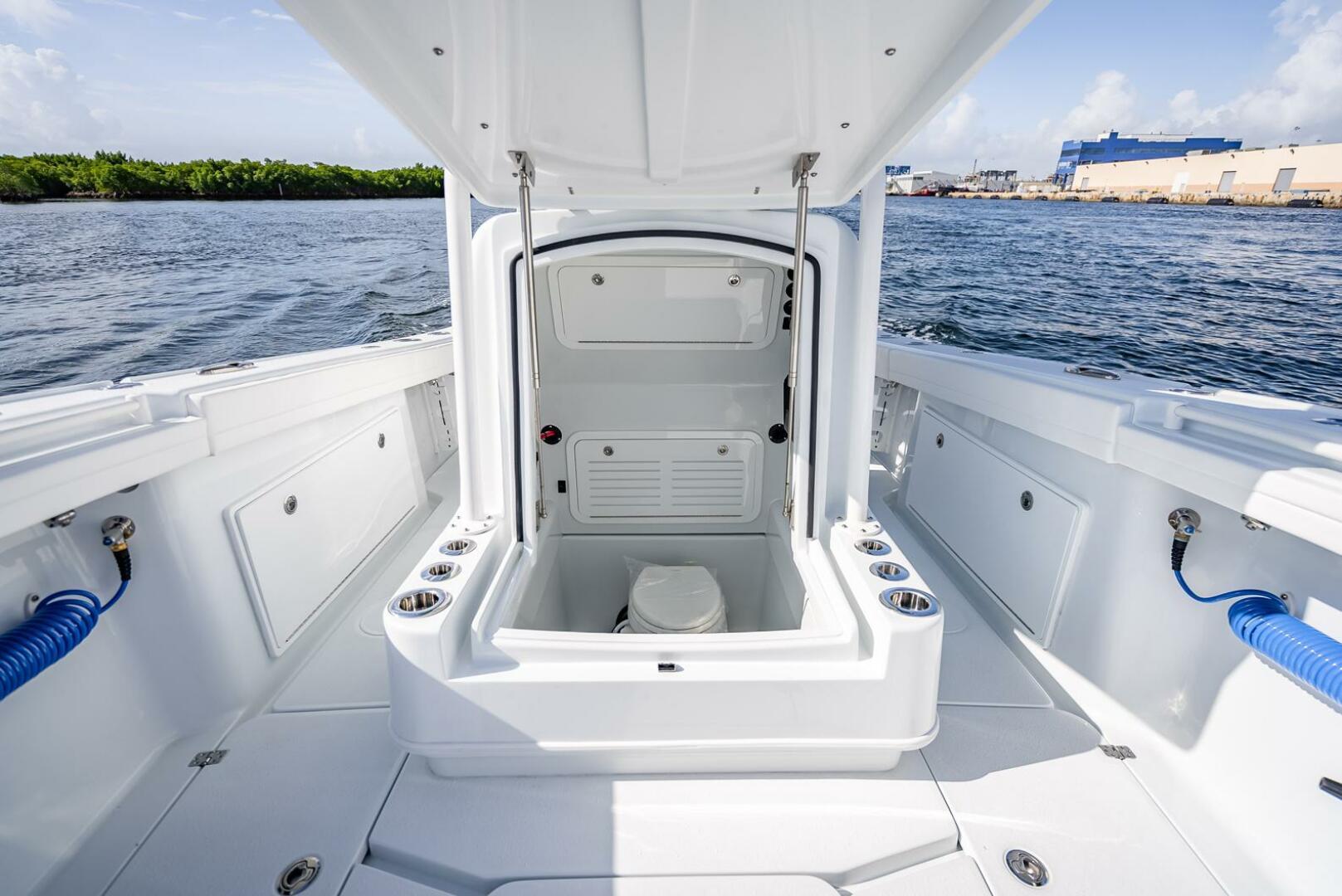 Yellowfin-34 Offshore 2025-34 Offshore FL-US-2025 Yellowfin 34 Offshore boat interior with open hatch, showcasing storage and seating area.-9806499 | Thumbnail
