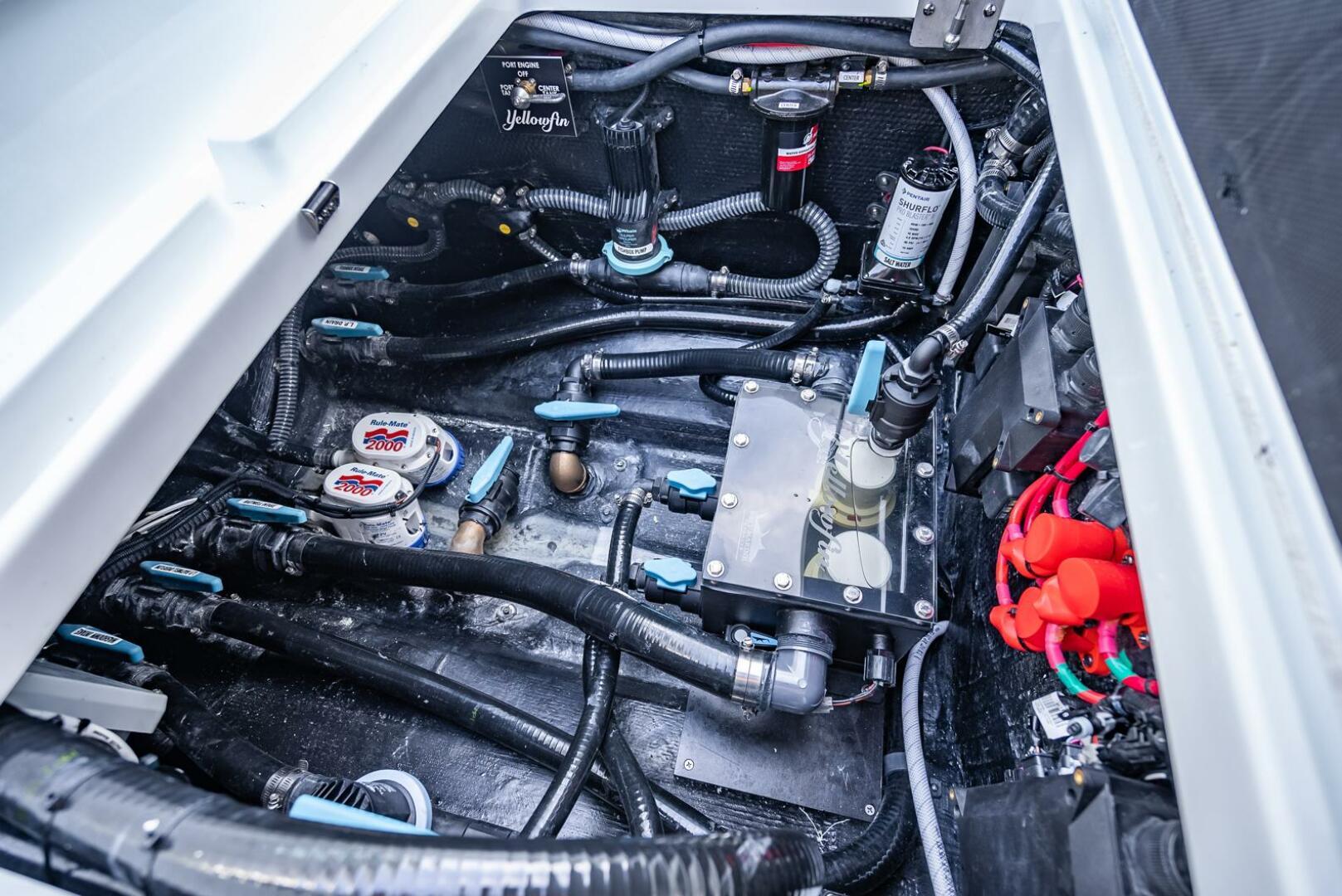 Yellowfin-34 Offshore 2025-34 Offshore FL-US-Engine compartment of a 2025 Yellowfin 34 Offshore boat, showcasing intricate wiring and components.-9806499 | Thumbnail