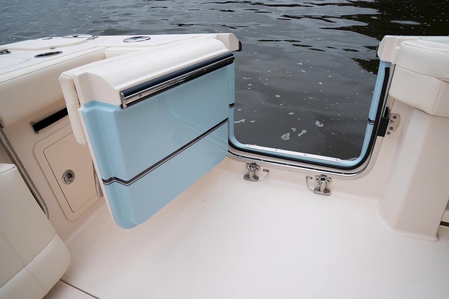 Manufacturer Provided Image: 2020 Grady-White Canyon 336 boat with open transom door by the water.