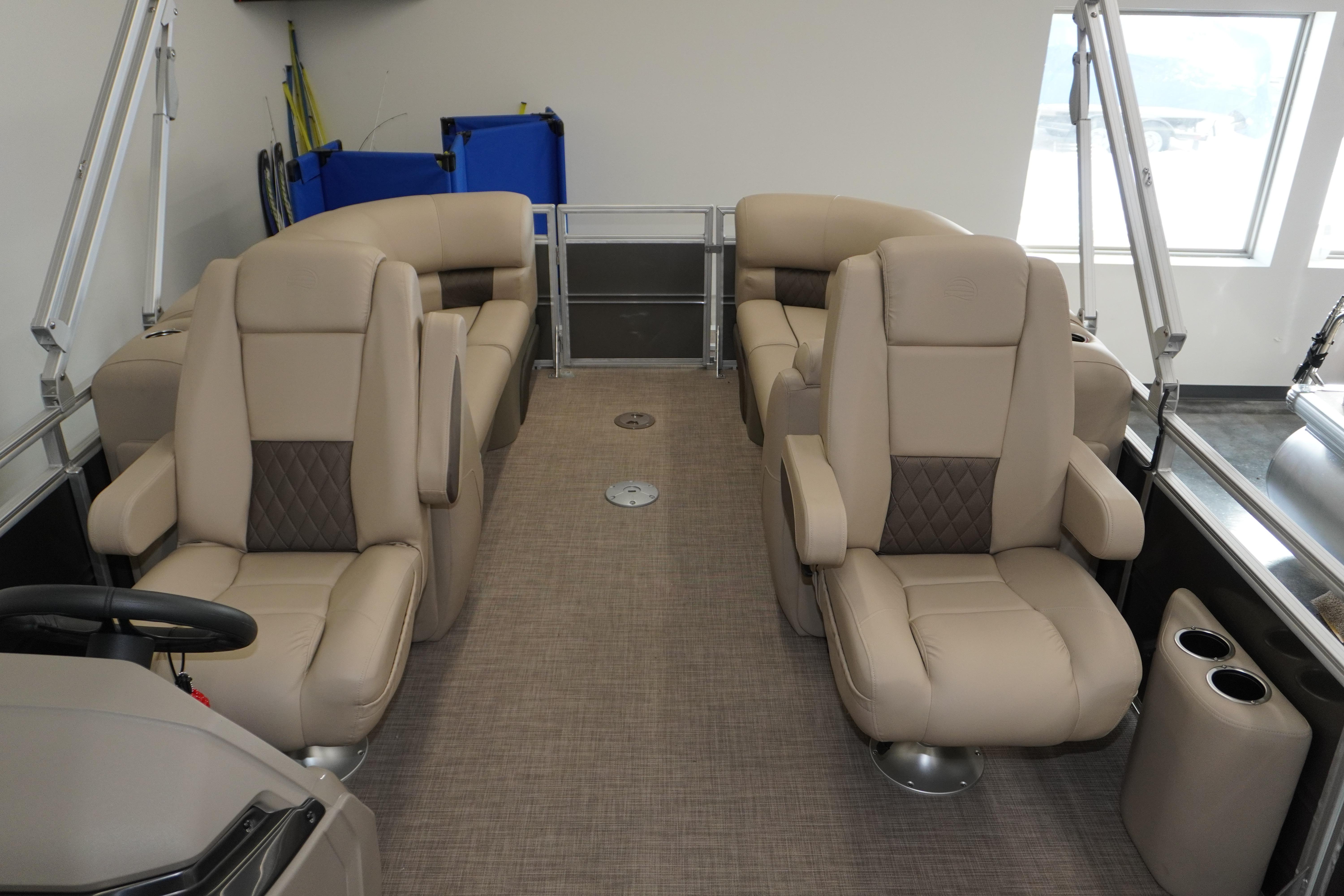 2024 Sun Tracker Party Barge 22 XP3 interior with beige seating and modern design.