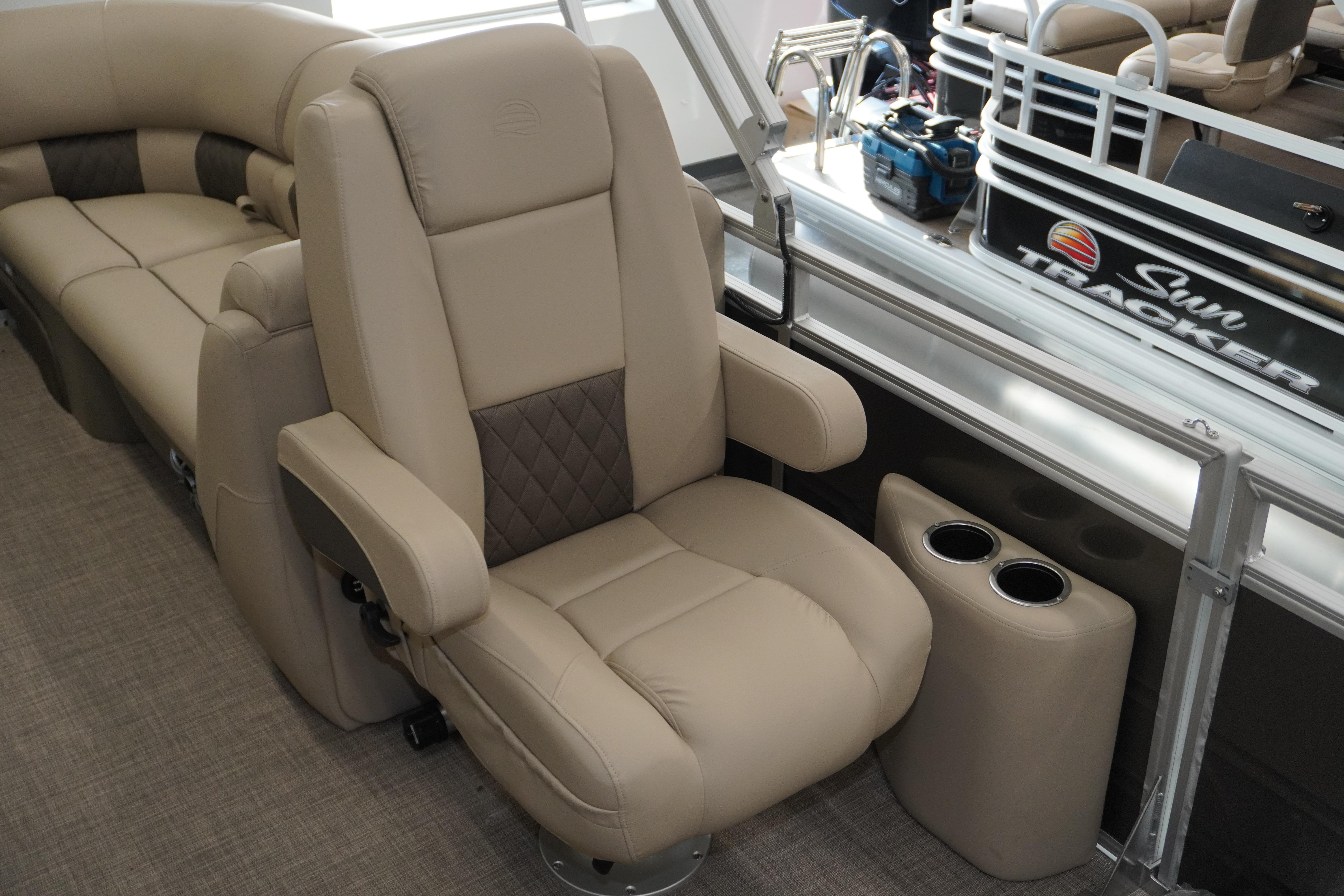 2024 Sun Tracker Party Barge 22 XP3 interior with plush seating and cup holders.