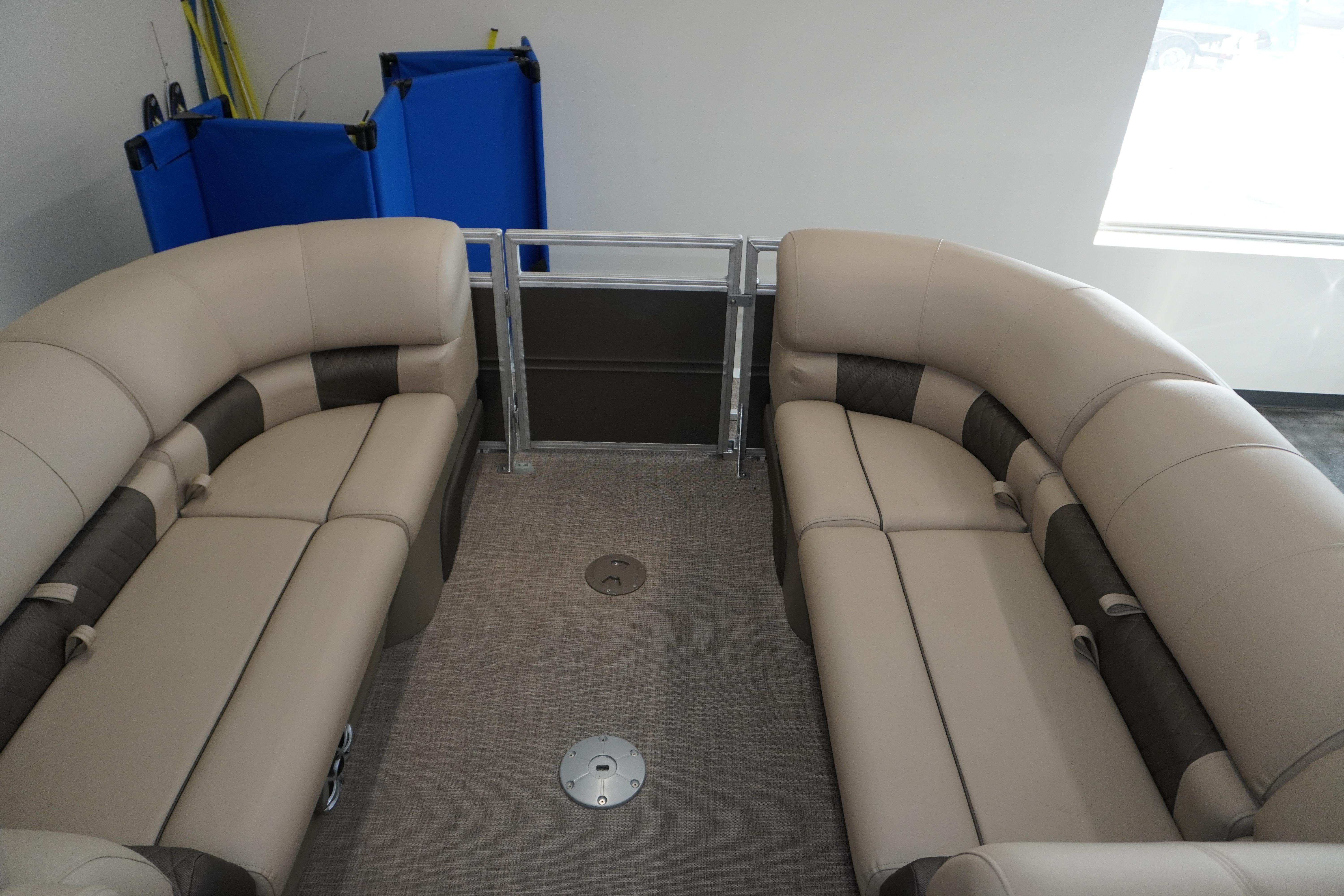 2024 Sun Tracker Party Barge 22 XP3 interior with beige seating and modern design.