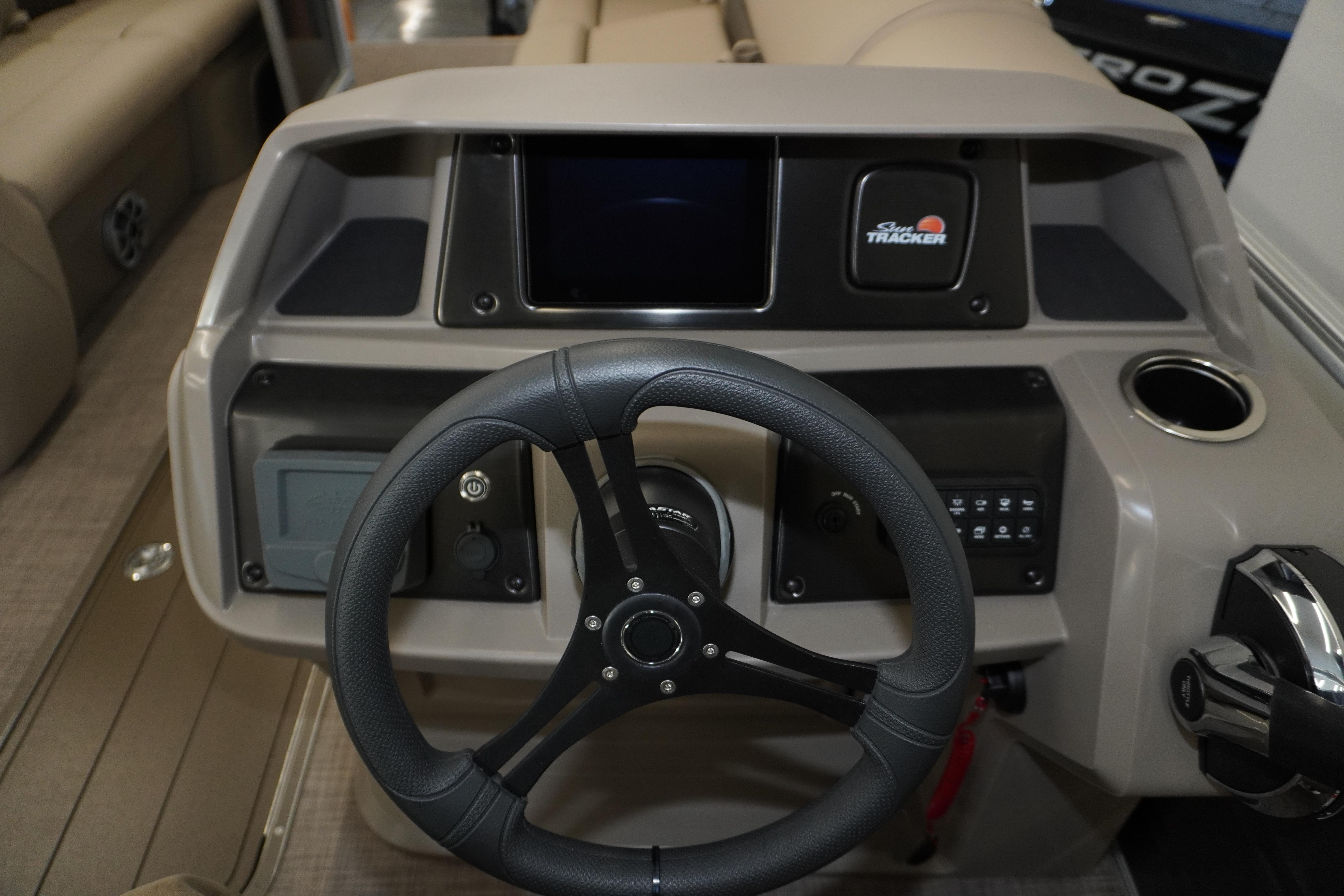 2024 Sun Tracker Party Barge 22 XP3 steering console with modern controls and cup holder.