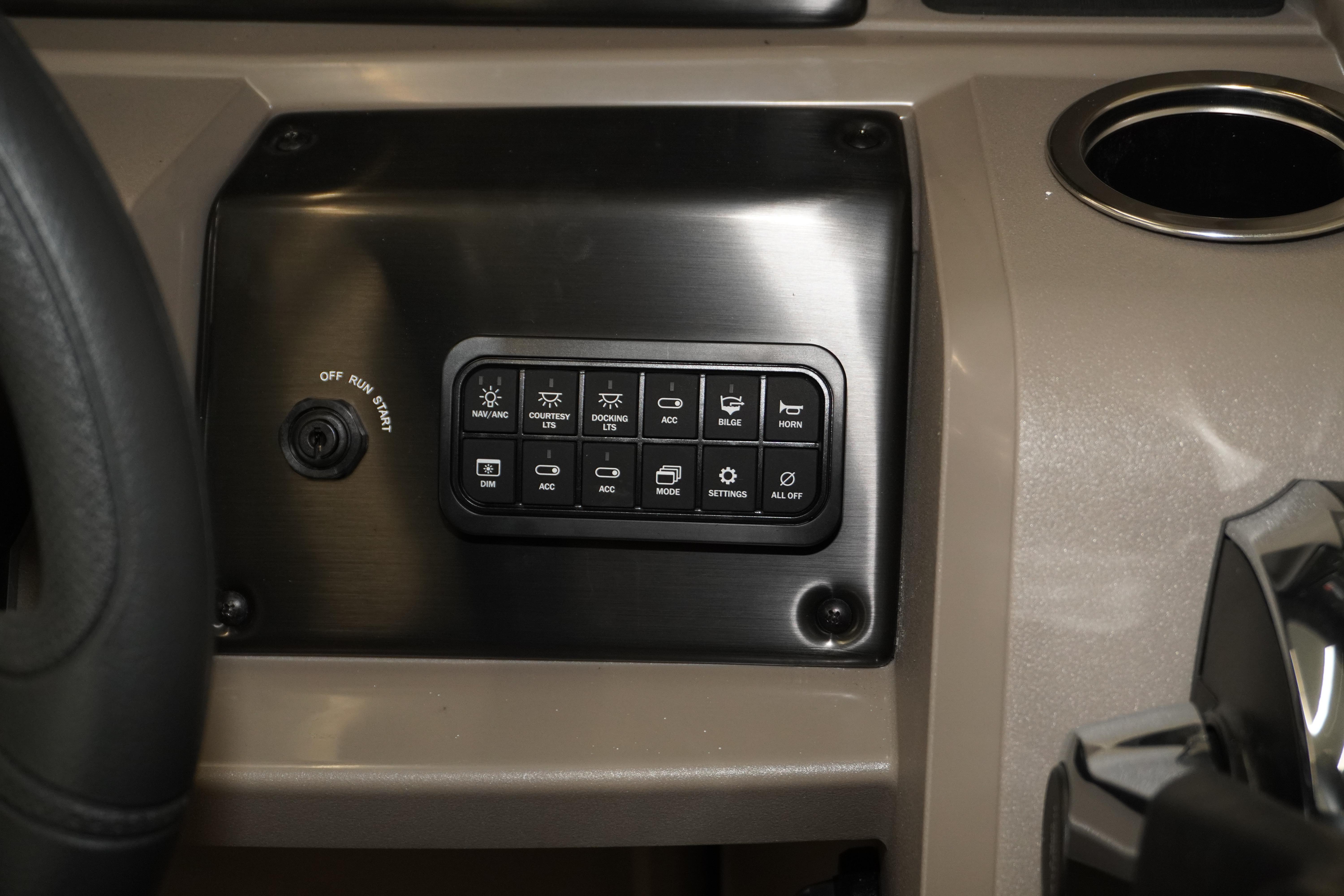 2024 Sun Tracker Party Barge 22 XP3 dashboard with control panel and cup holder.