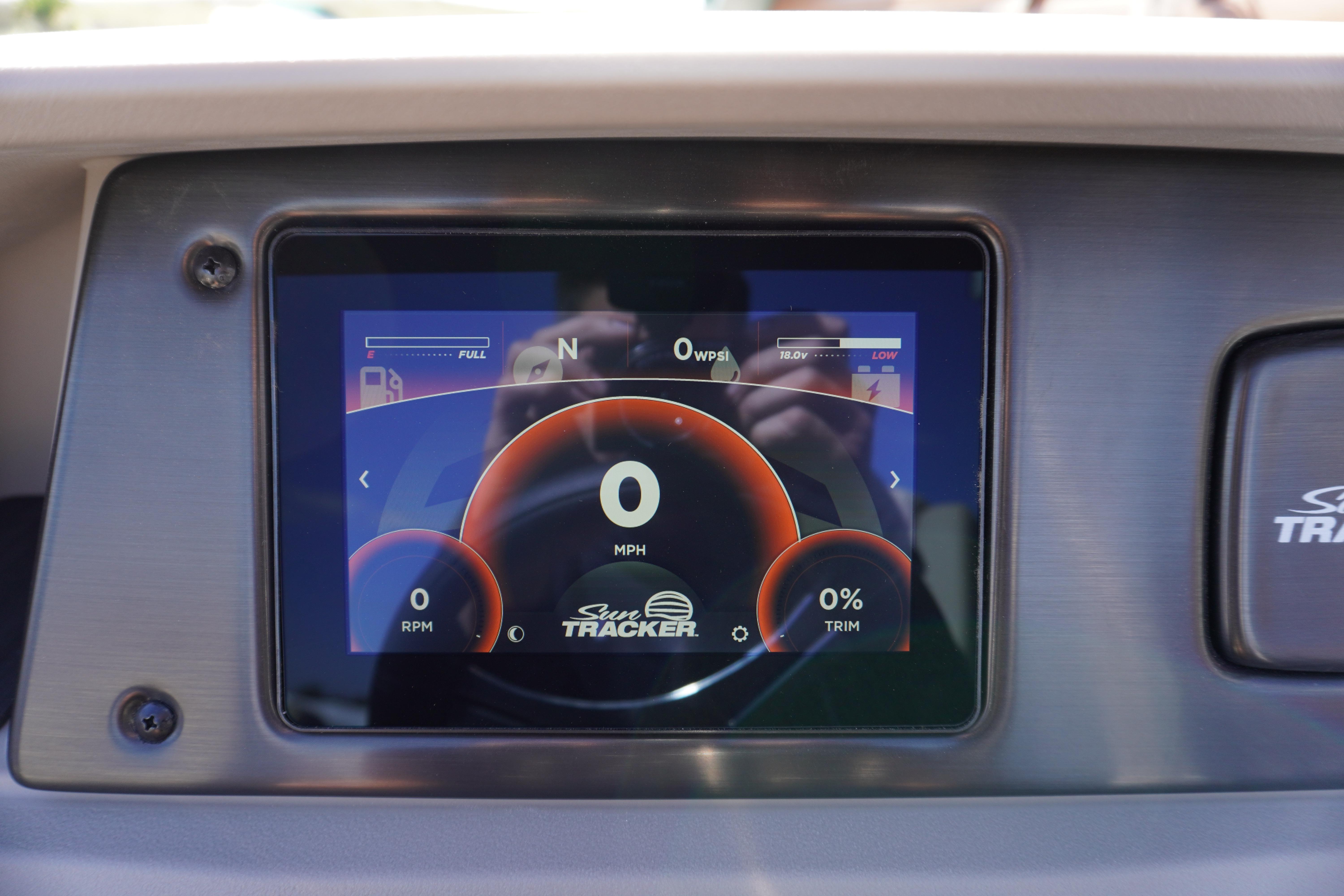 Dashboard display of 2024 Sun Tracker Fishin' Barge 20 DLX showing speed and fuel indicators.