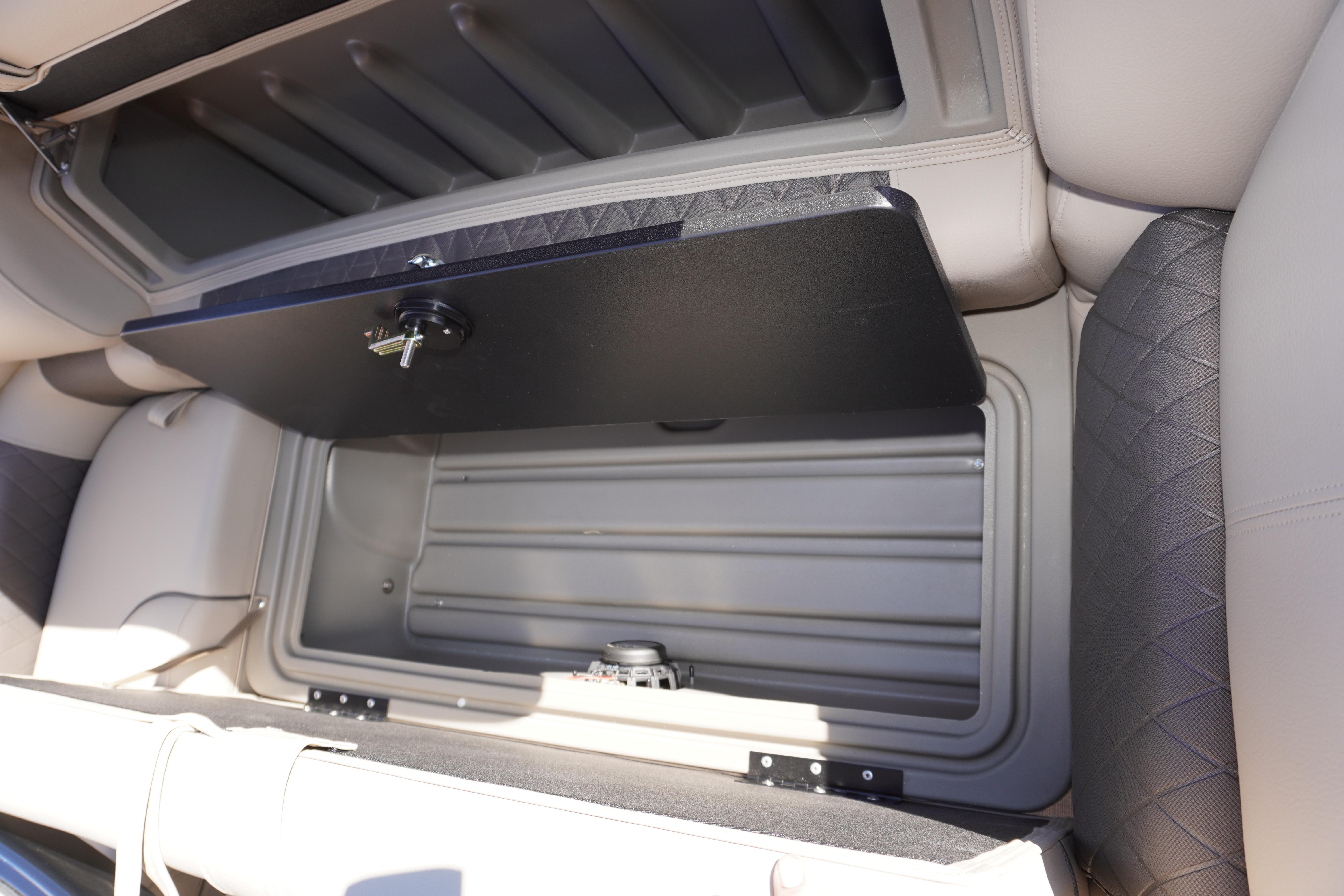 2024 Sun Tracker Fishin' Barge 20 DLX storage compartment with open lid, showcasing interior space.