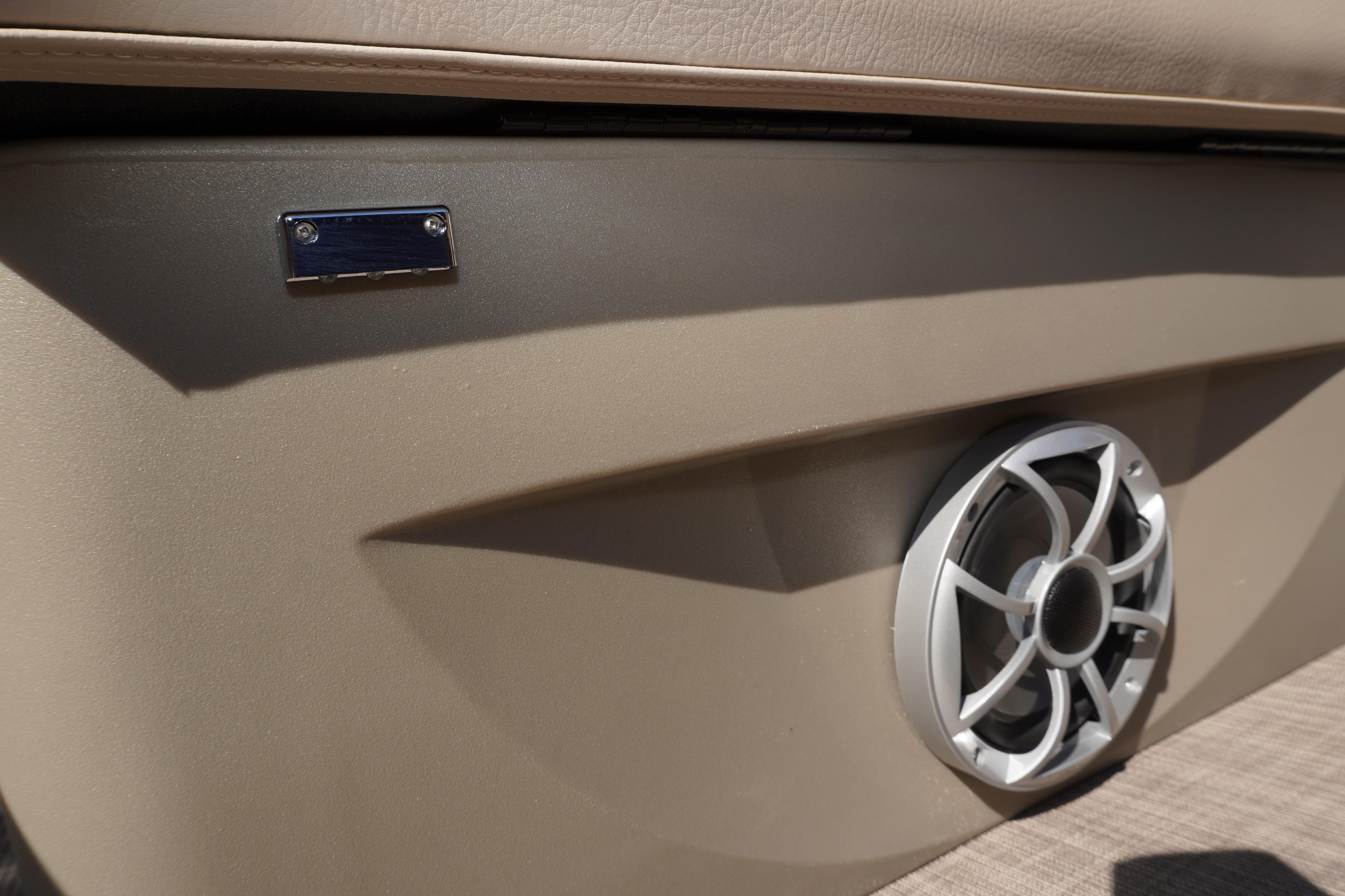 2024 Sun Tracker Fishin' Barge 20 DLX speaker detail, beige interior.