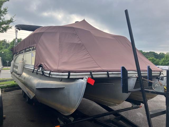 2007 Bennington 2275QXi pontoon boat with brown cover on trailer.