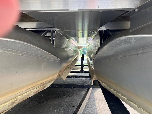 Underneath view of a 2007 Bennington 2275QXi pontoon boat on a trailer.