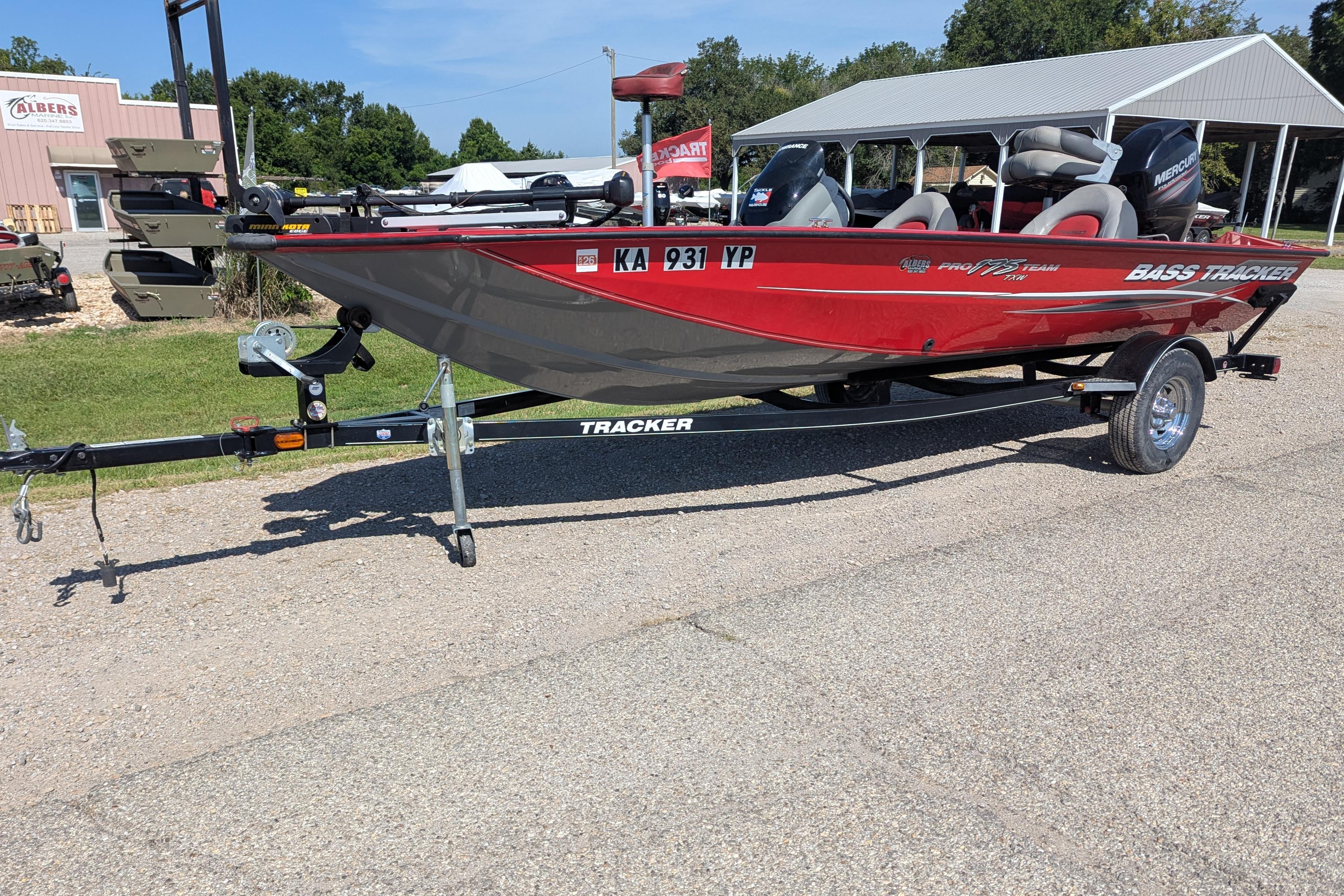 2015 Tracker Pro Team 175 TXW bass boat on trailer, parked outdoors.