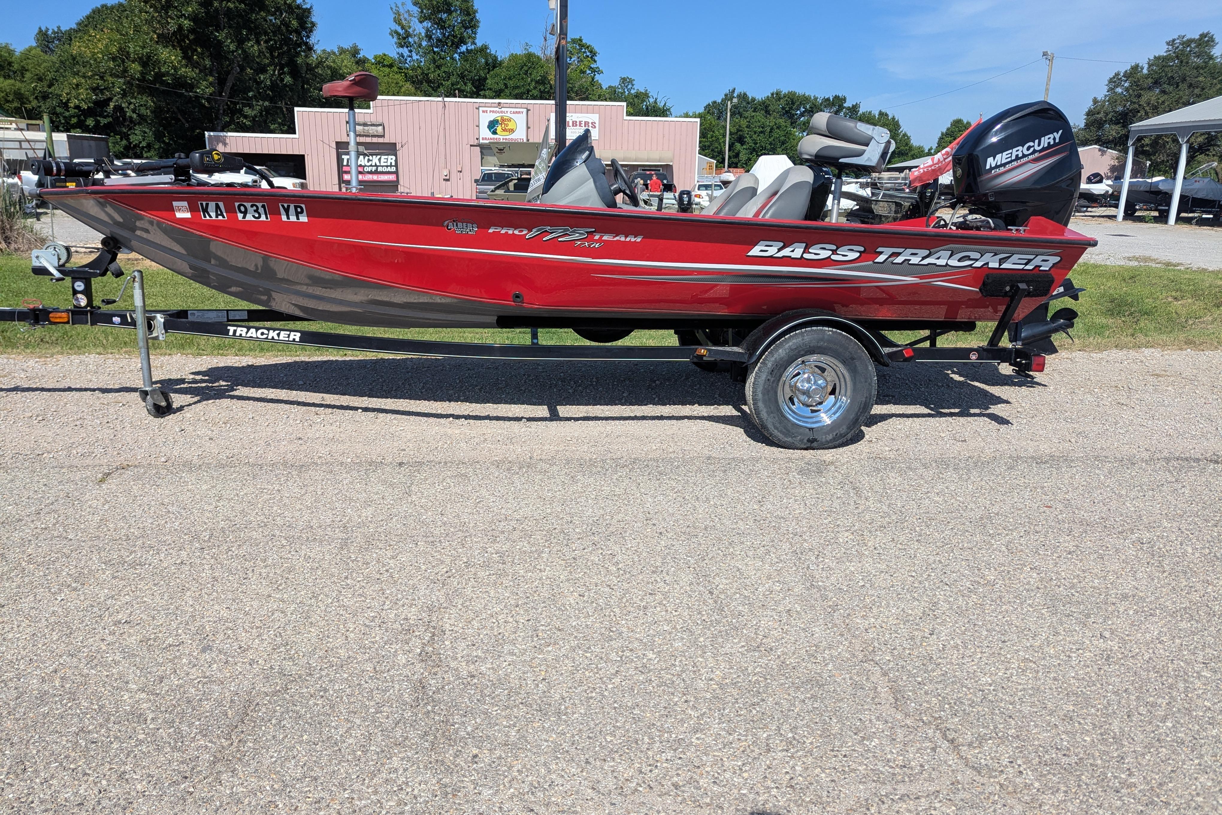2015 Tracker Pro Team 175 TXW bass boat on trailer, parked outdoors.