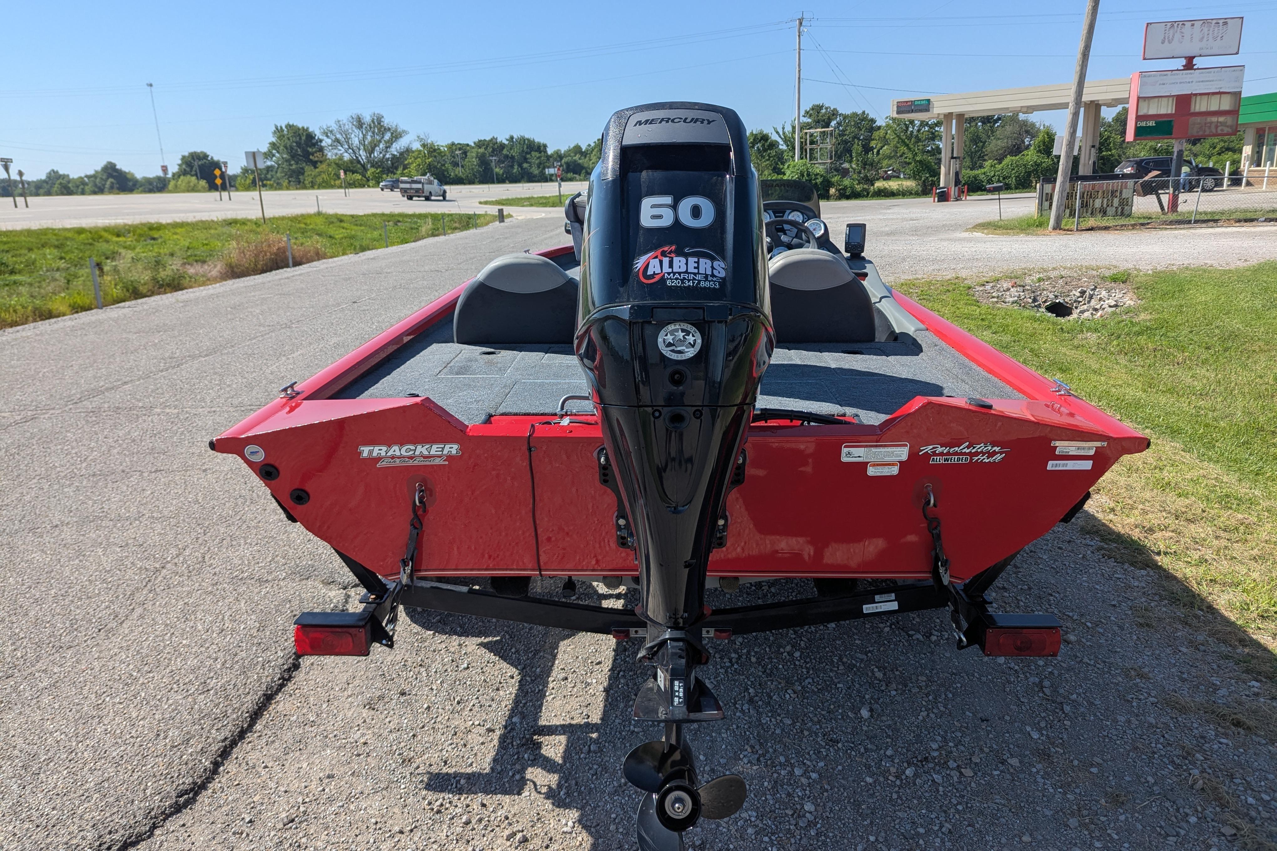 2015 Tracker Pro Team 175 TXW boat with Mercury 60 engine on roadside.
