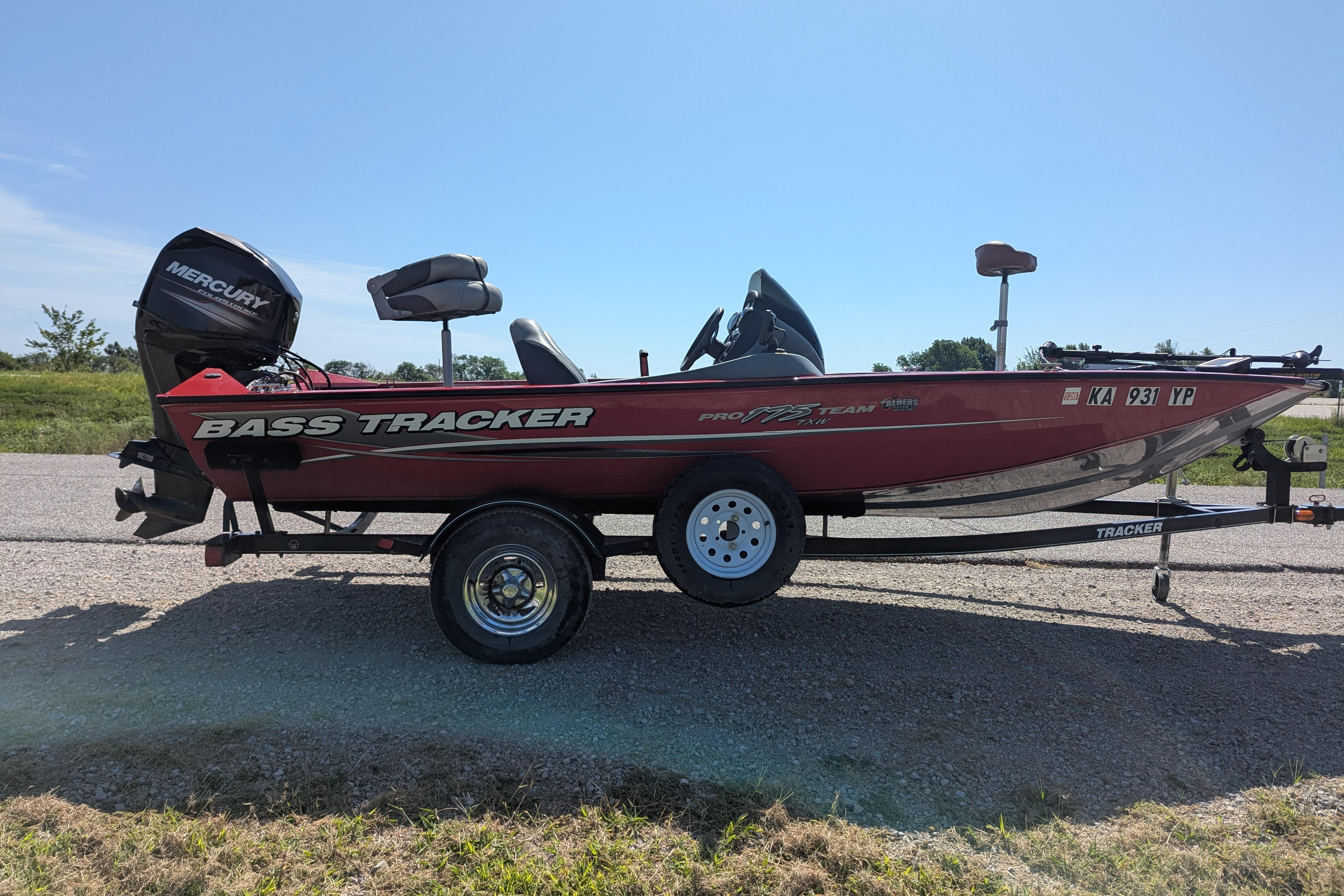 2015 Tracker Pro Team 175 TXW bass boat on trailer, parked on roadside.