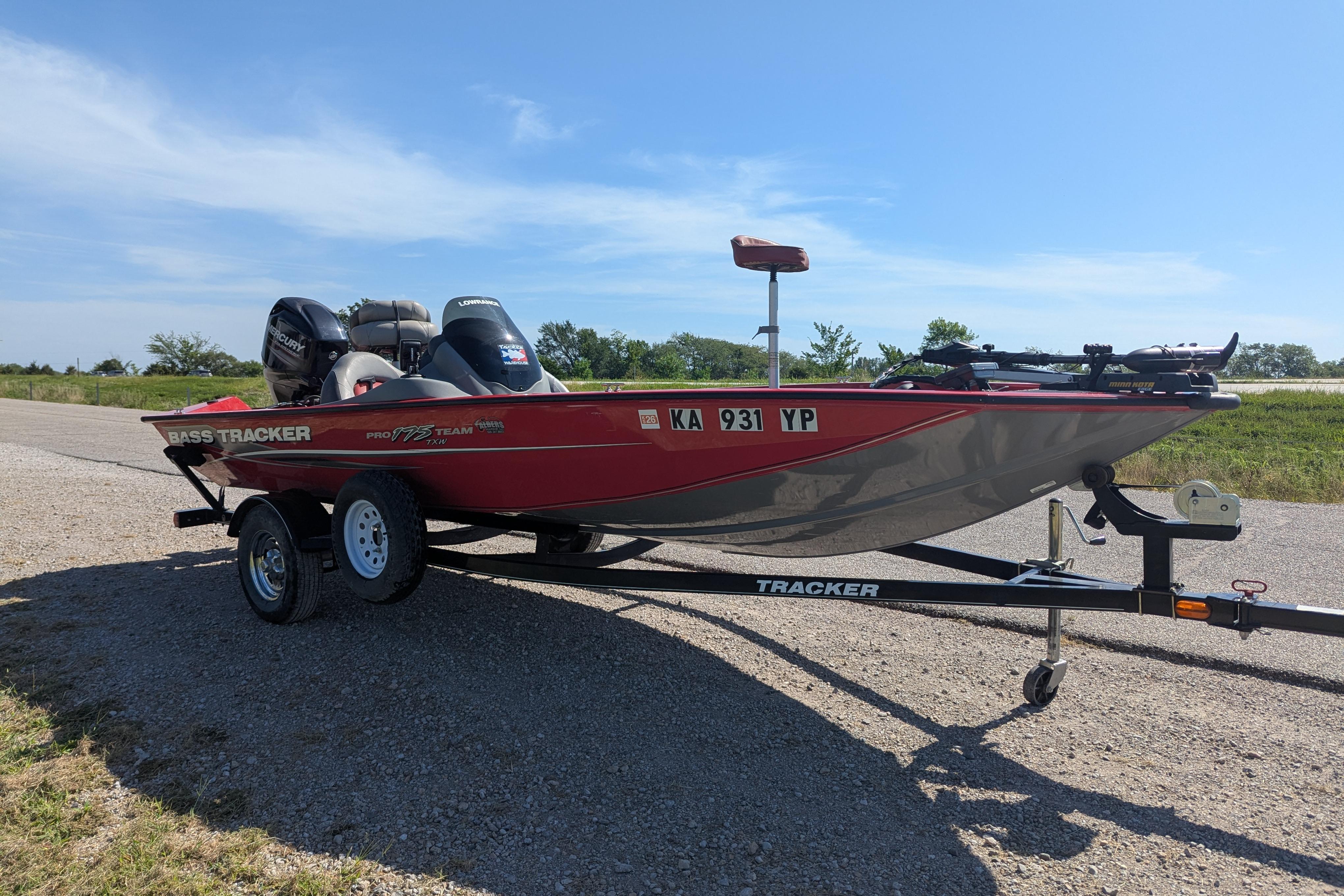 2015 Tracker Pro Team 175 TXW boat on trailer, parked on gravel road.