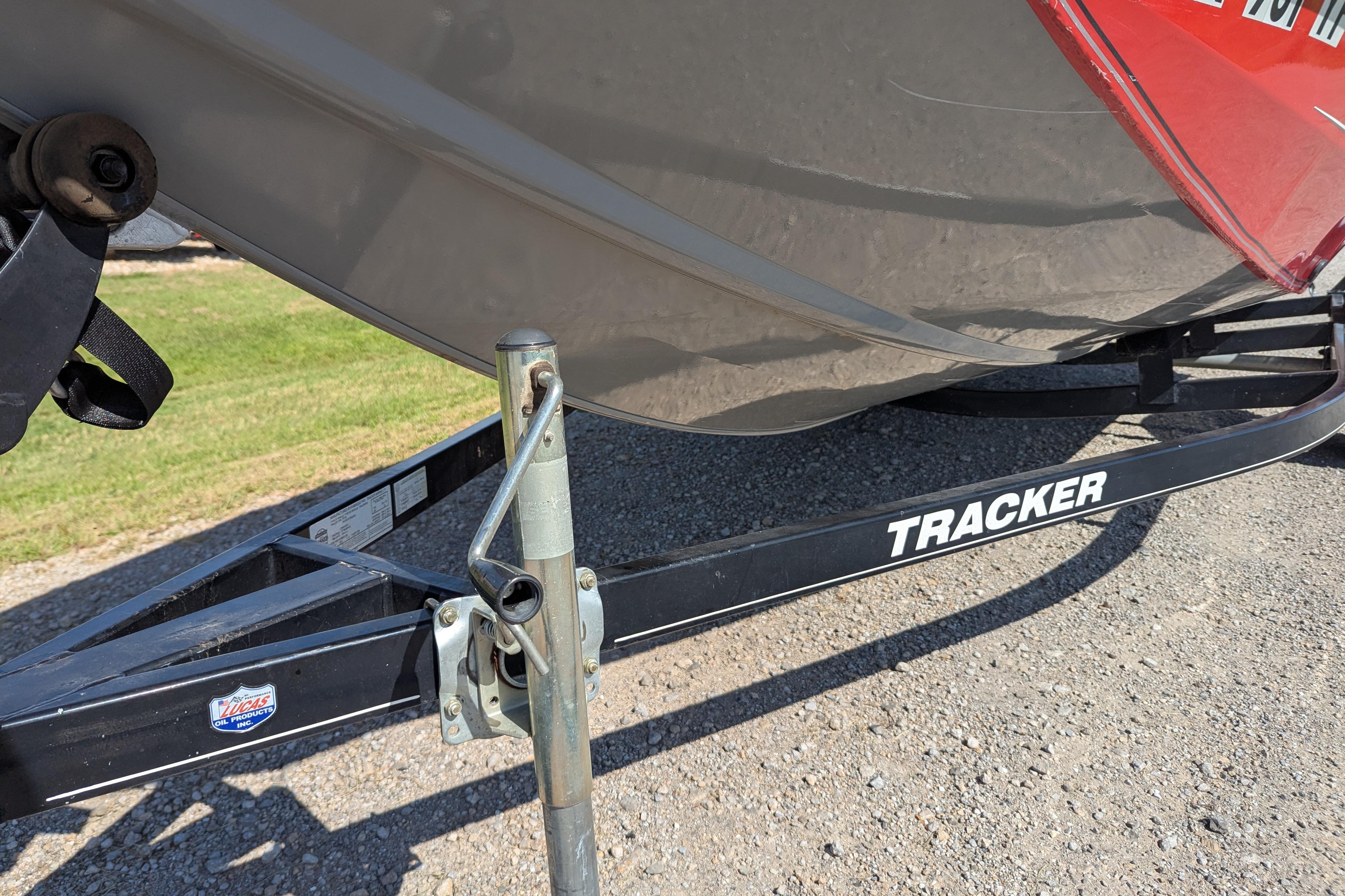 2015 Tracker Pro Team 175 TXW boat trailer on gravel surface.