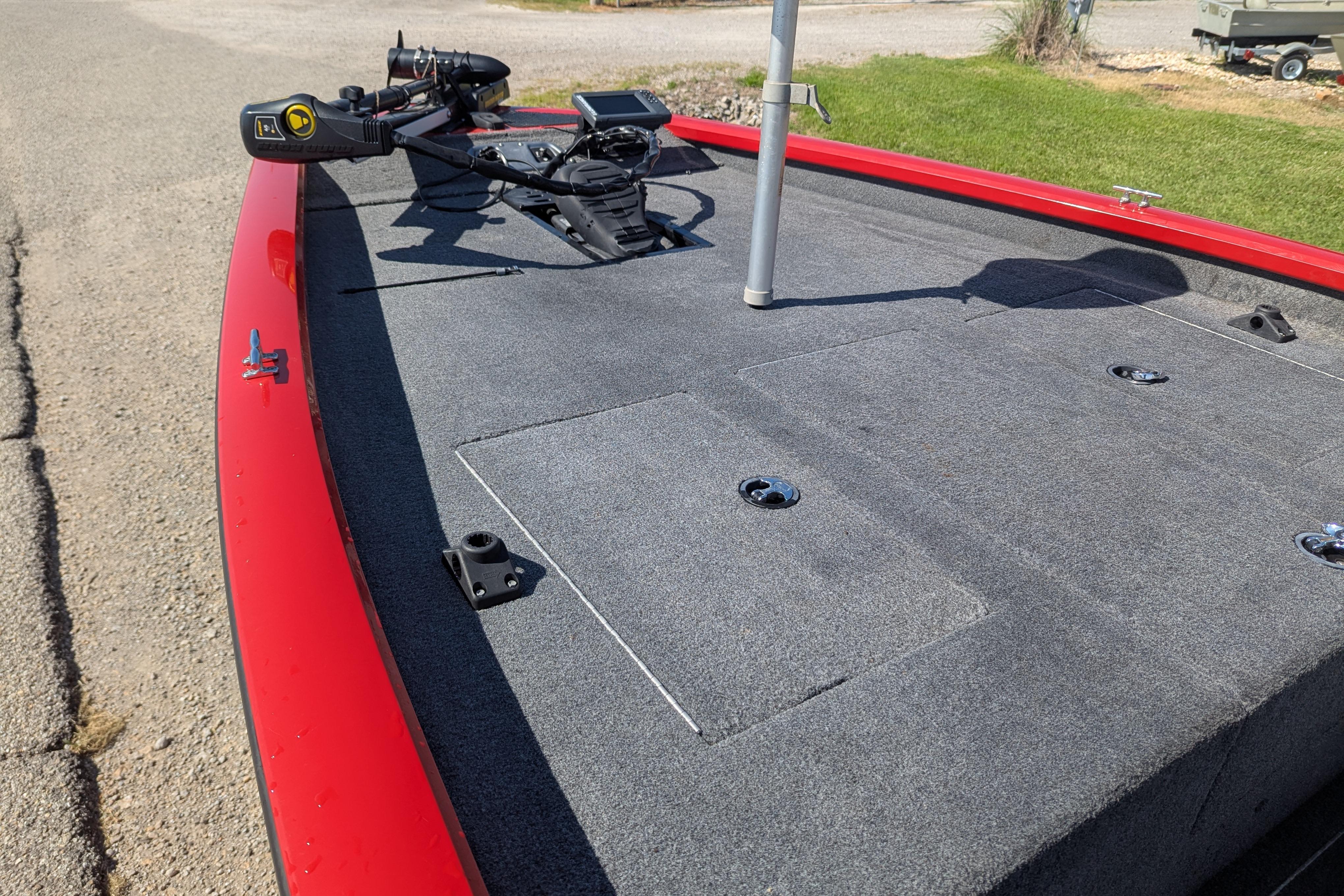 2015 Tracker Pro Team 175 TXW boat deck with red trim and fishing equipment.