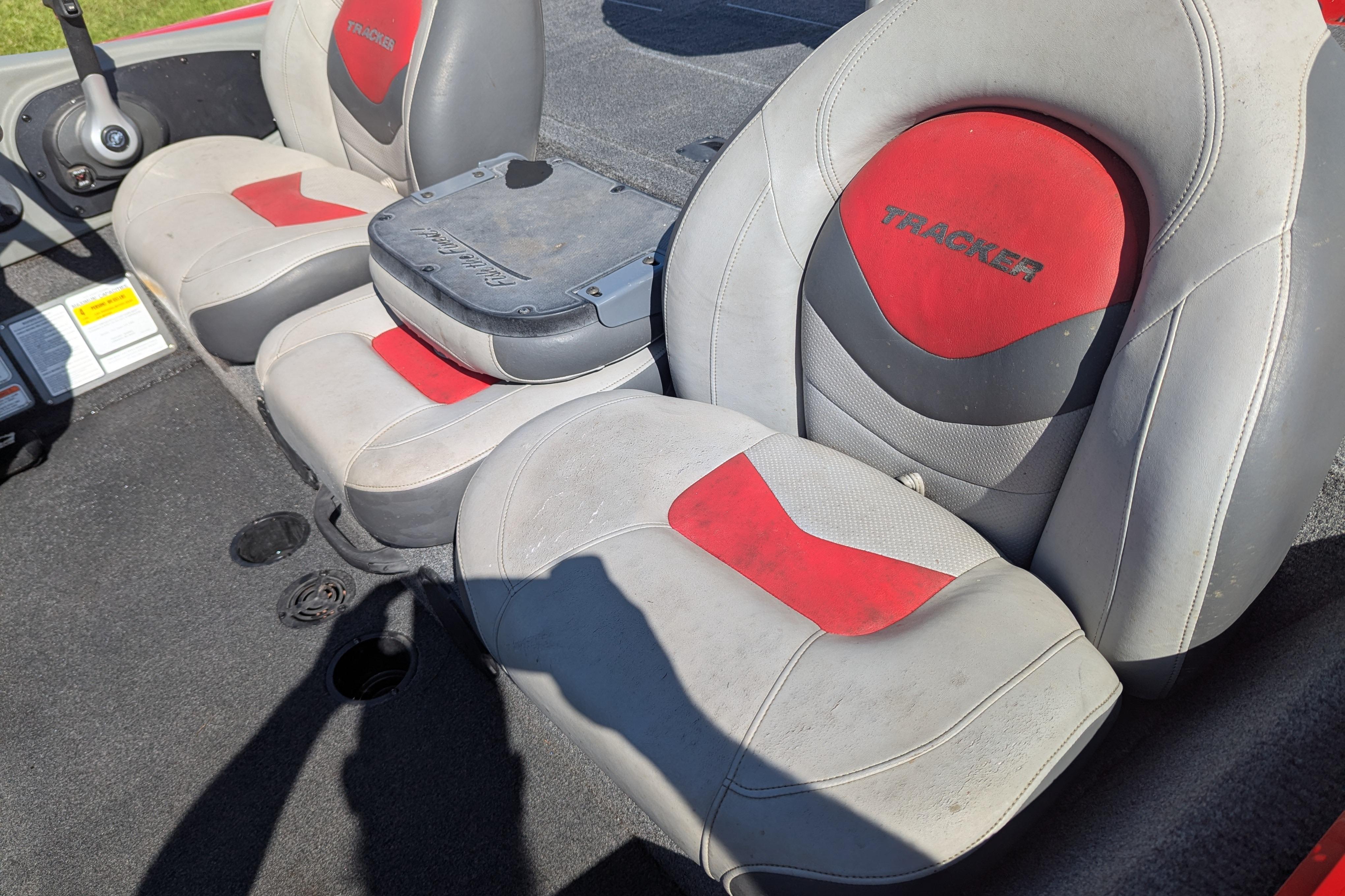 2015 Tracker Pro Team 175 TXW boat seats with red and gray upholstery.