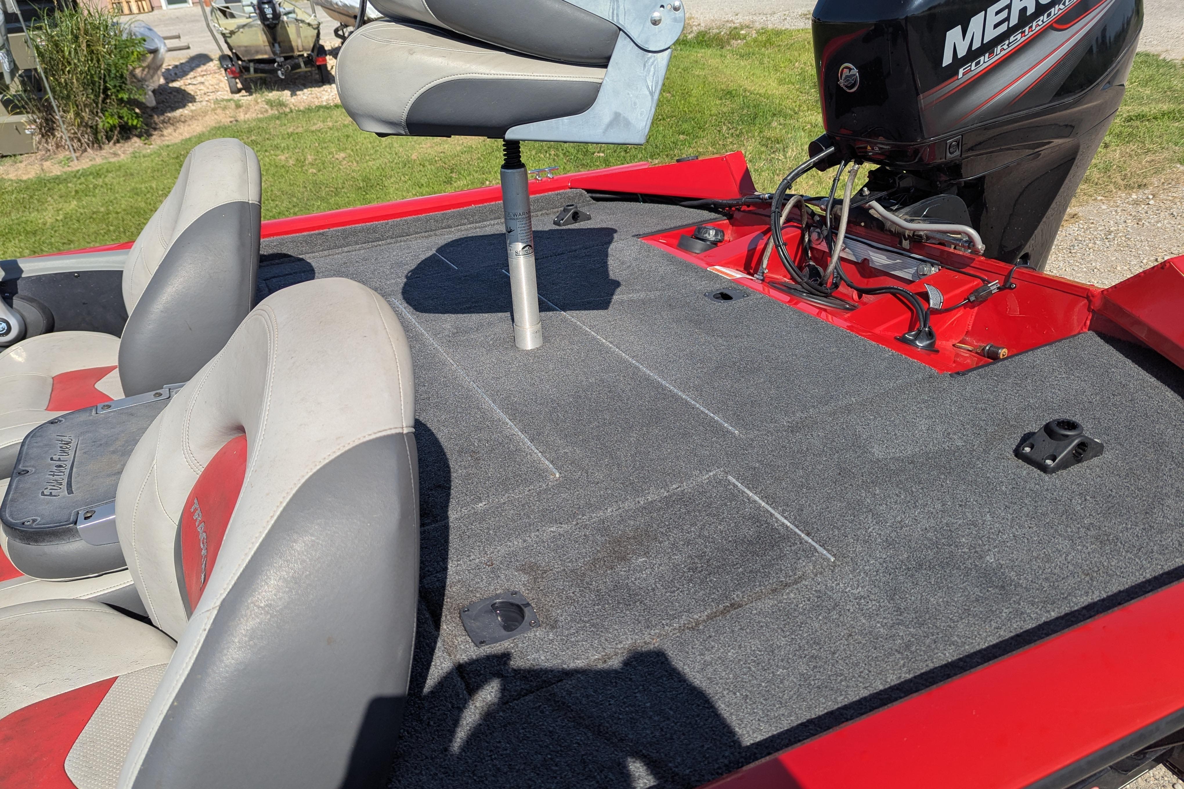 2015 Tracker Pro Team 175 TXW boat interior with seats and Mercury engine.
