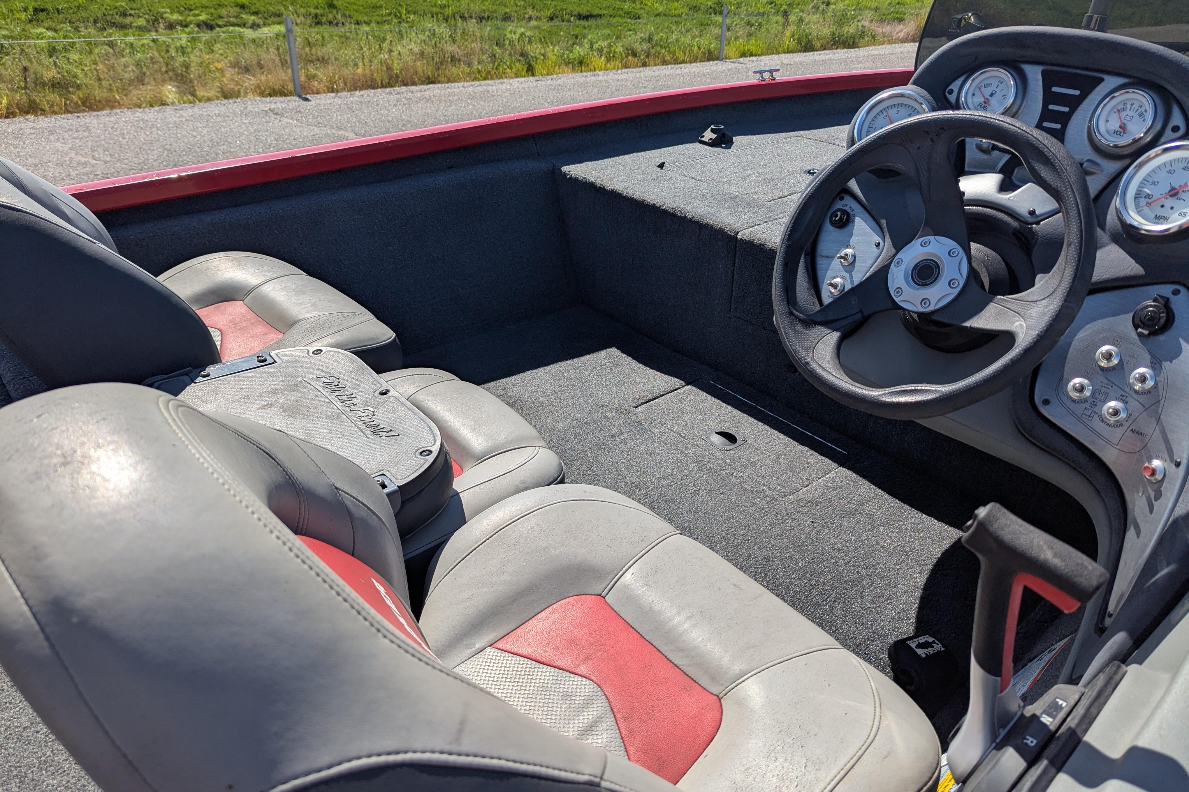 2015 Tracker Pro Team 175 TXW boat interior with steering wheel and seats.