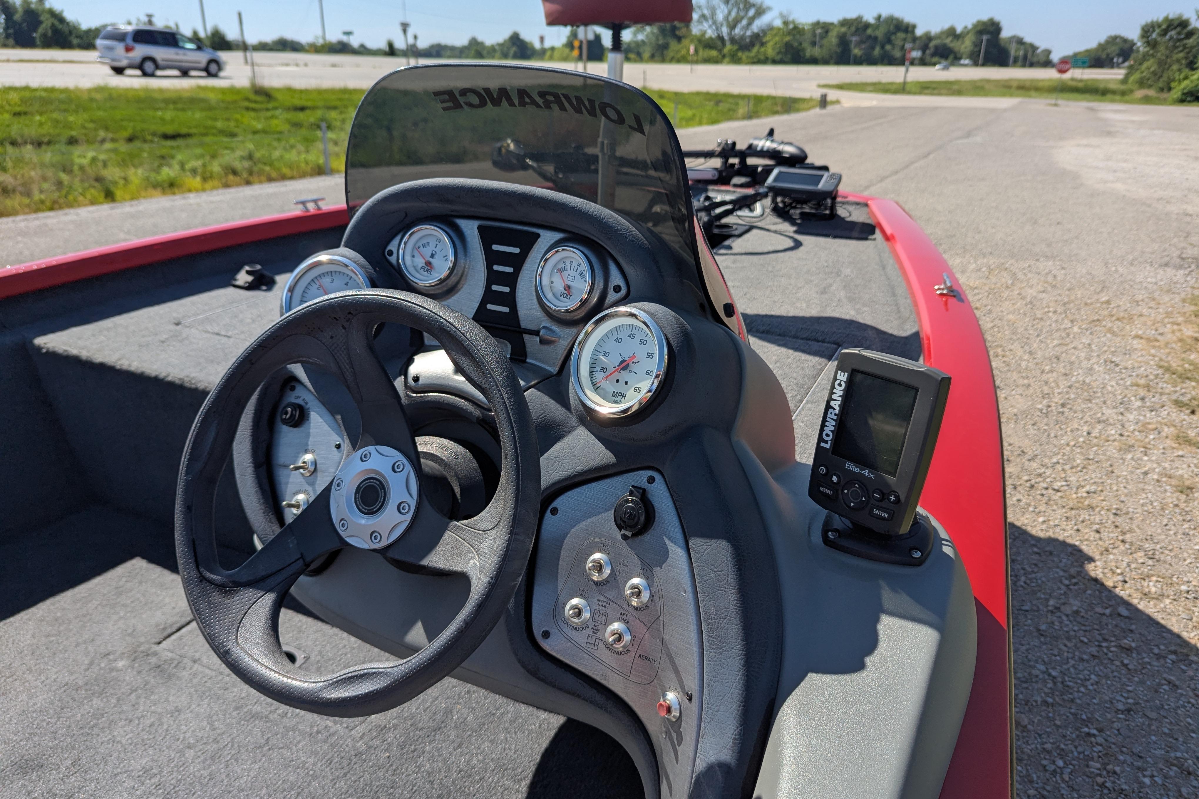 2015 Tracker Pro Team 175 TXW boat dashboard with steering wheel and gauges.