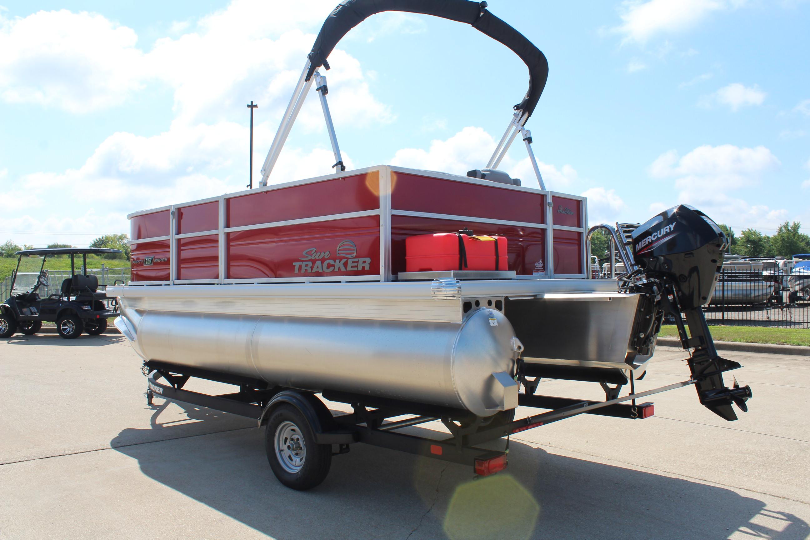 2026 Sun Tracker Party Barge 16 DLX pontoon boat on trailer, featuring Mercury outboard motor.